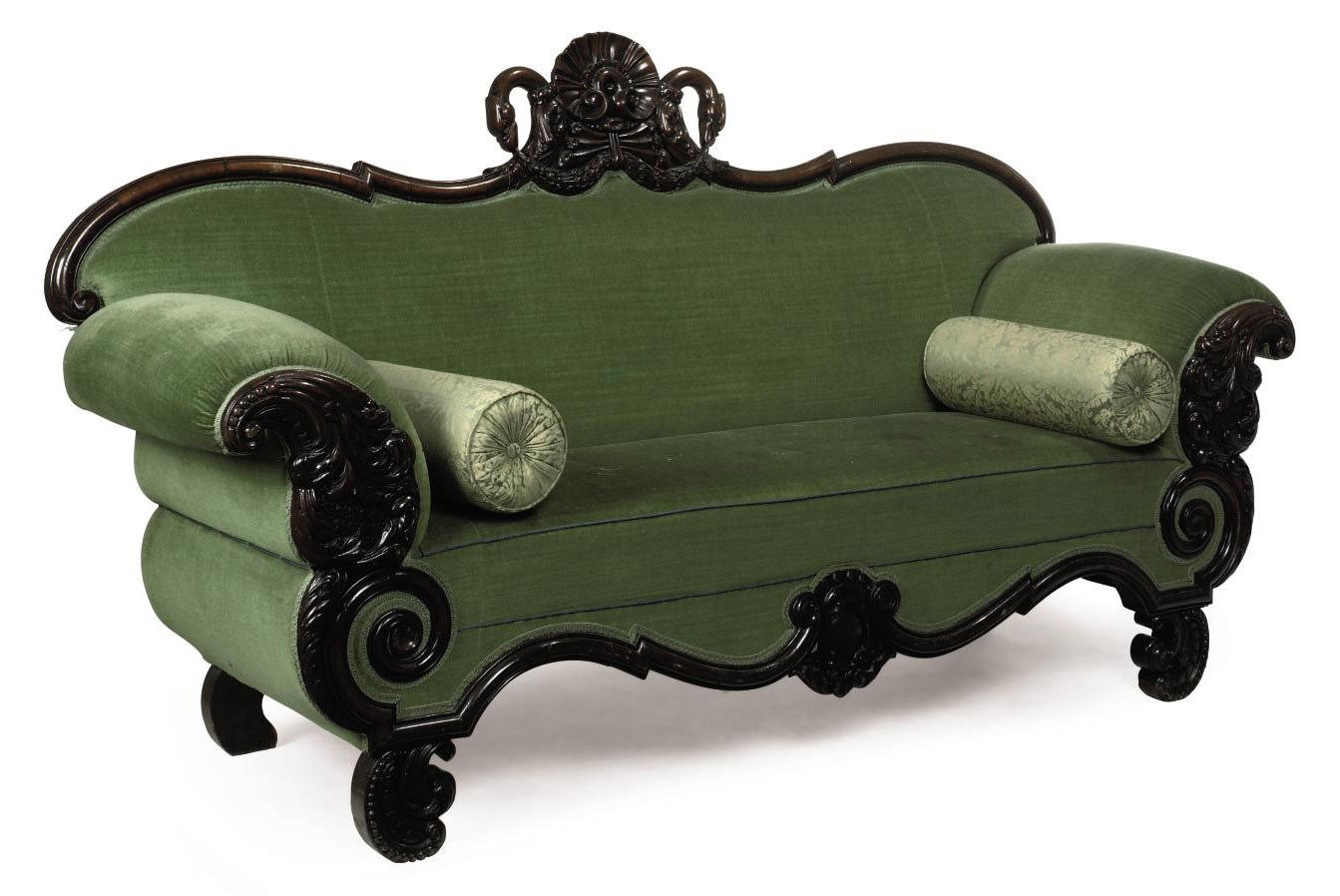 A CARVED MAHOGANY SOFA
