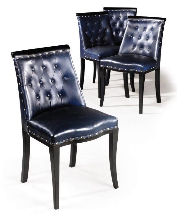 A SET OF FOUR FRENCH EBONISED WOOD AND LEATHER UPHOLSTERED DINING CHAIRS