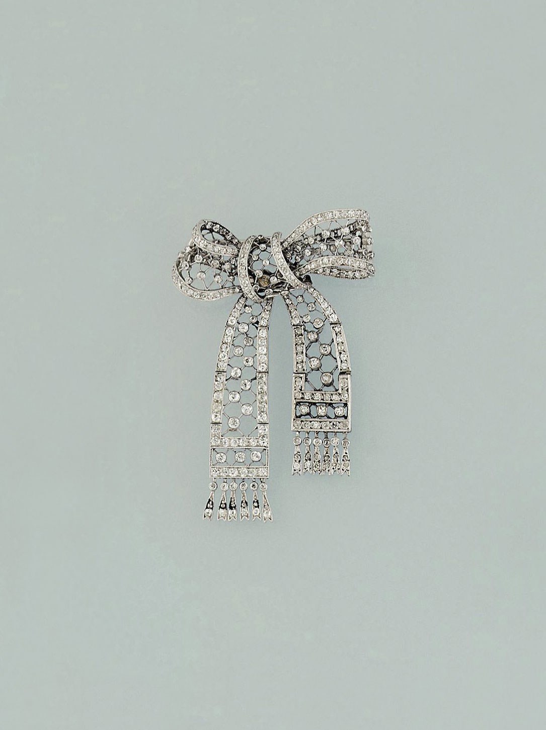 A diamond bow brooch