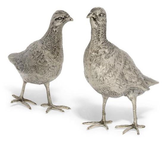 A PAIR OF SPANISH METALWARE GROUSE TABLE ORNAMENTS