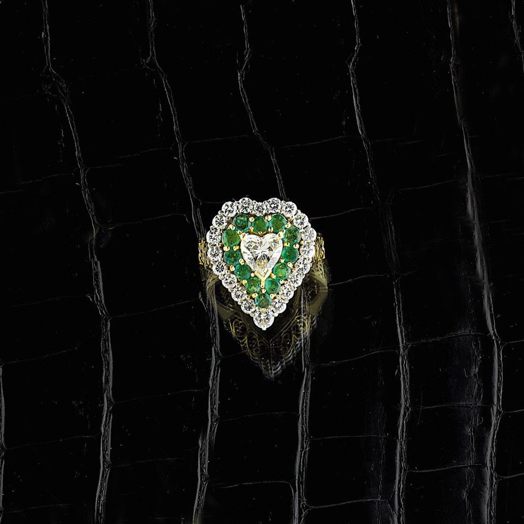 A diamond and emerald cluster ring