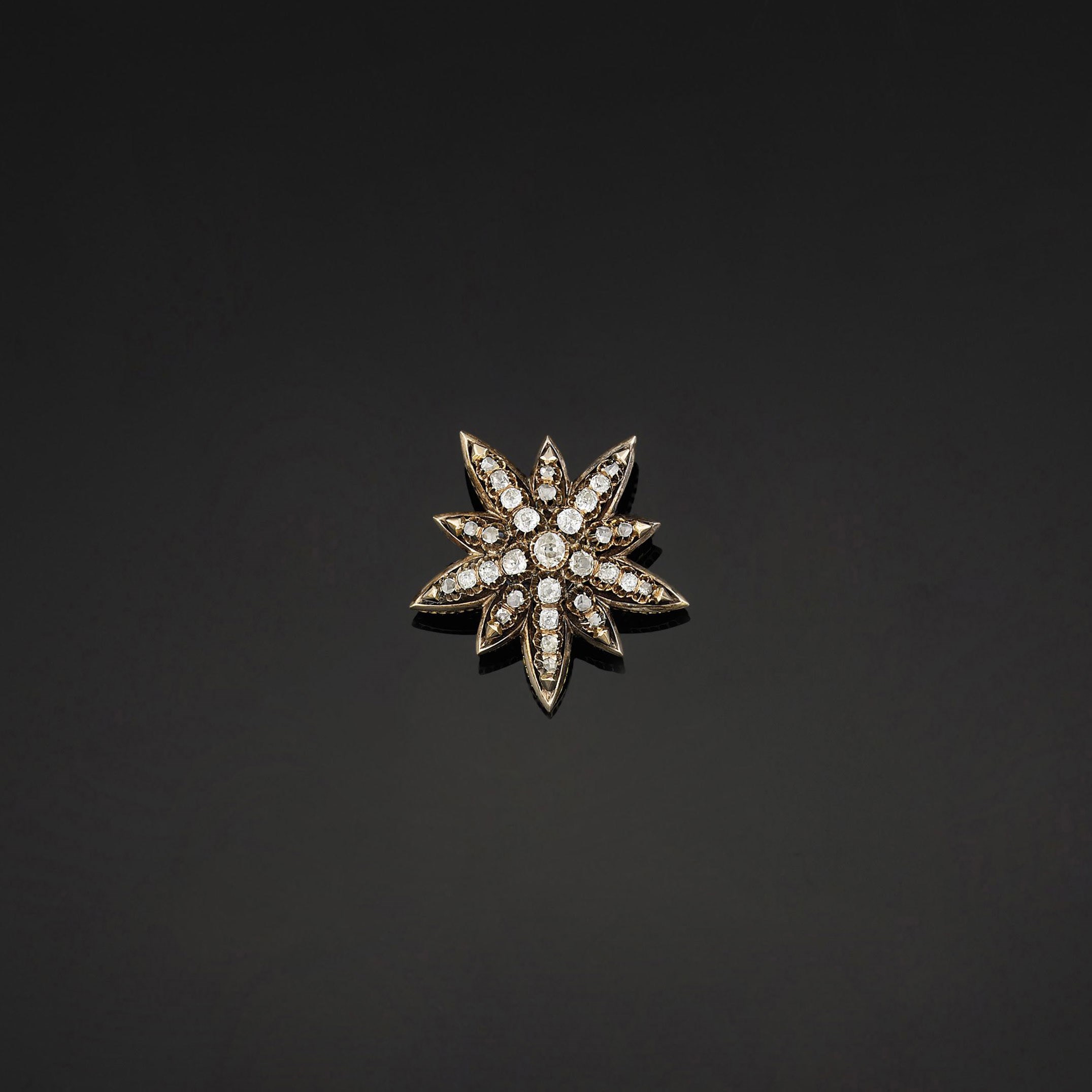 A diamond star brooch