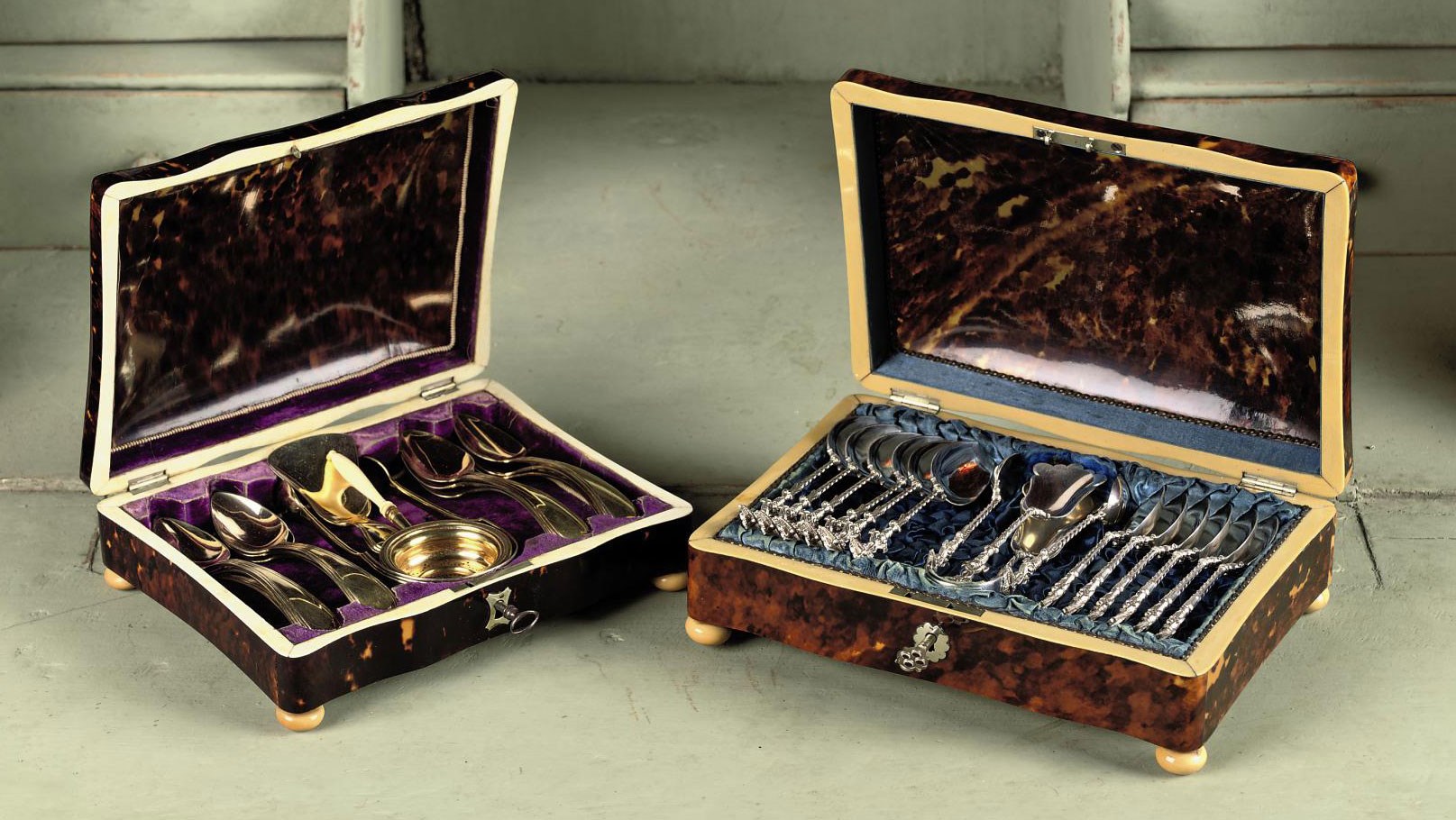 Two tortoise-shell spoon boxes with silver and silver-gilt tea-spoons