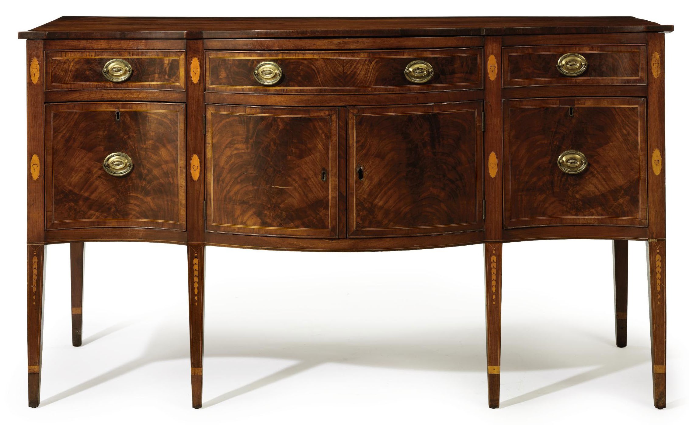A FEDERAL MAHOGANY VENEERED WALNUT SERPENTINE-FRONT SIDEBOARD