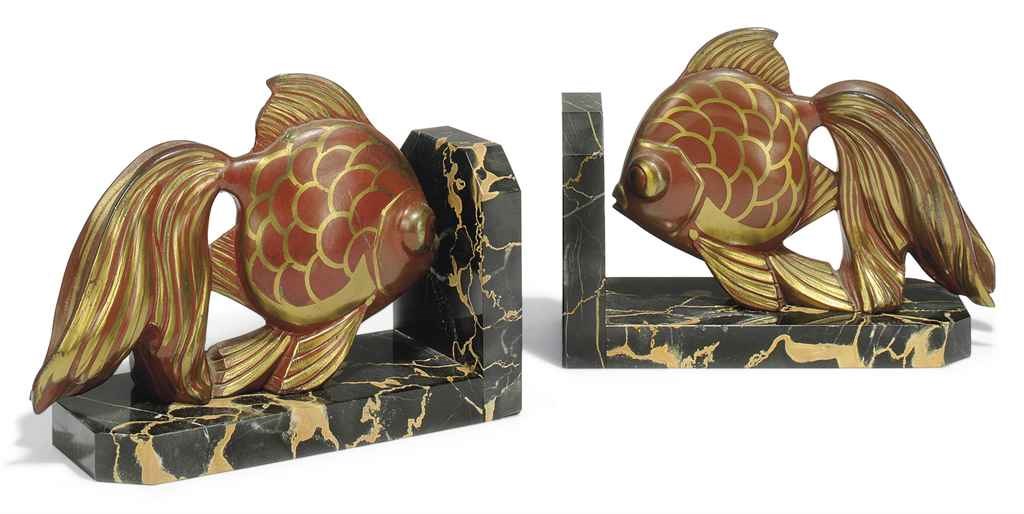 A PAIR OF ROCHAUD GILT AND PATINATED-SPELTER AND BELGIAN GOLD MARBLE 'TROPICAL FISH' BOOKENDS