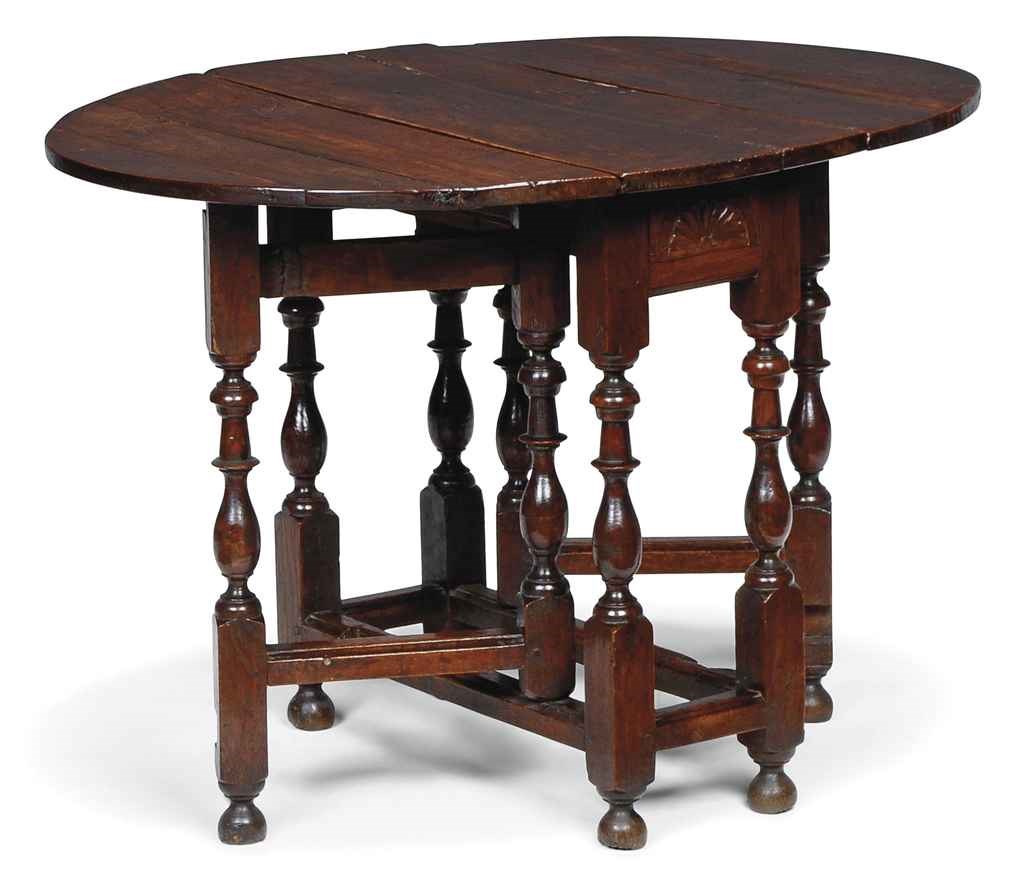 A WILLIAM AND MARY WALNUT AND OAK GATELEG TABLE