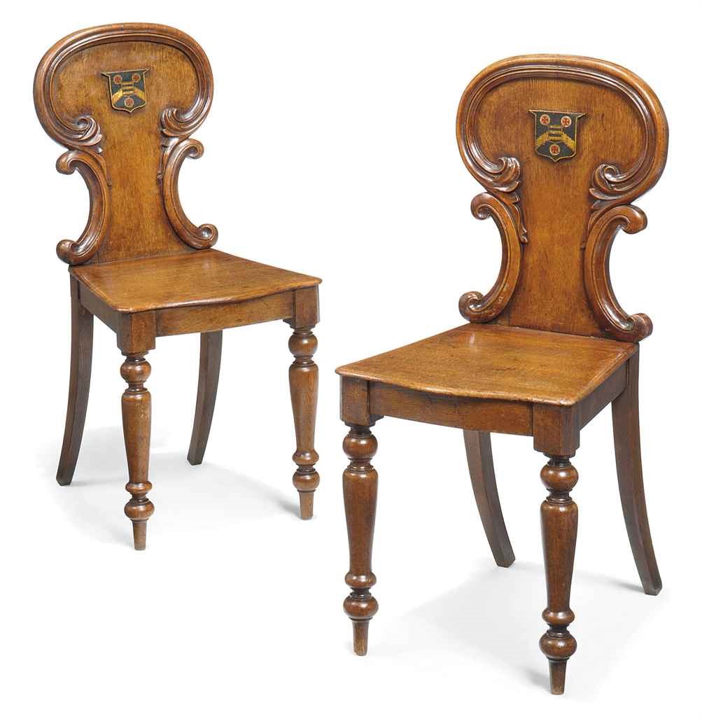 A PAIR OF MID-VICTORIAN OAK HALL CHAIRS