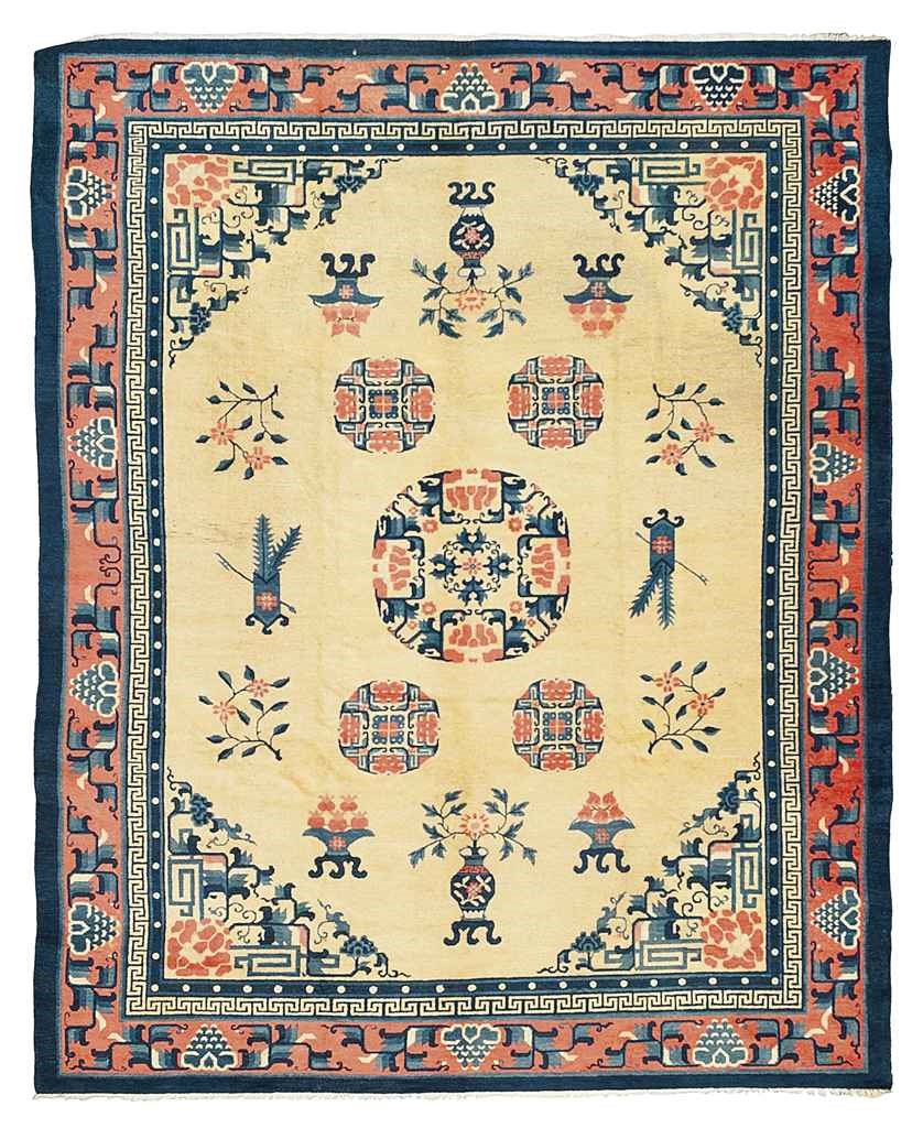 AN ANTIQUE CHINESE CARPET