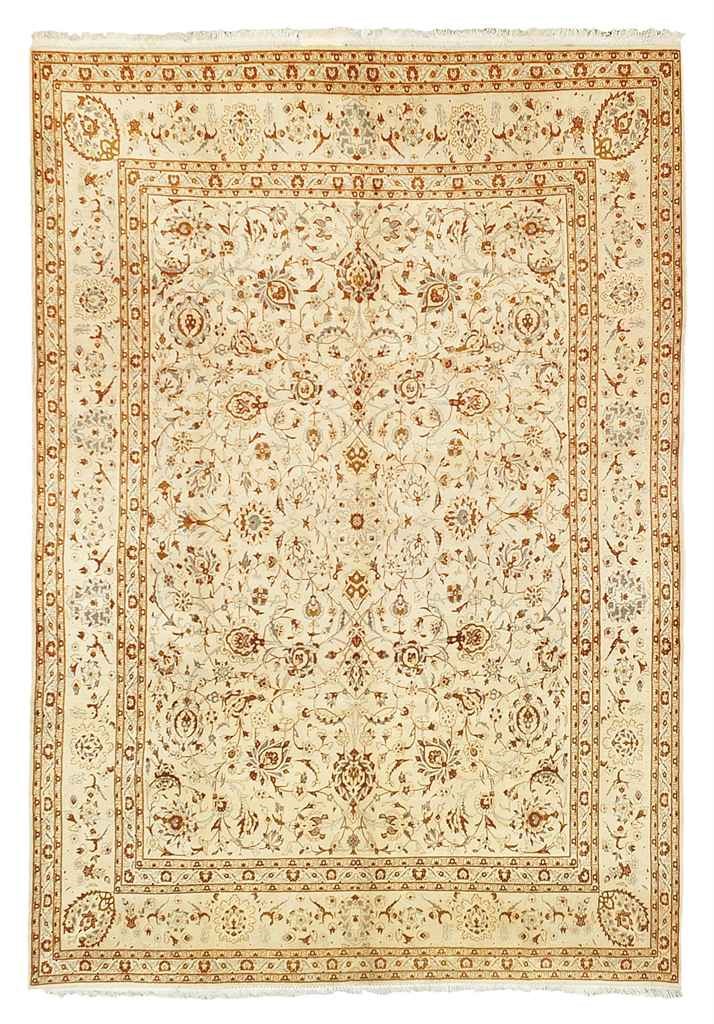 A FINE KASHAN CARPET
