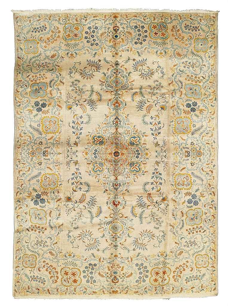 A FINE KASHAN CARPET