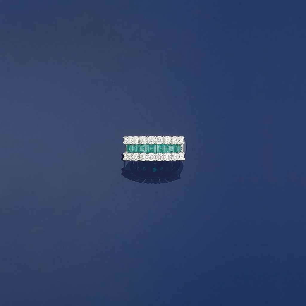 An emerald and diamond ring