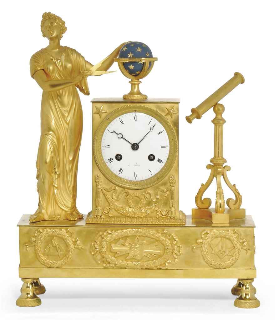 AN EMPIRE ORMOLU STRIKING MANTEL CLOCK