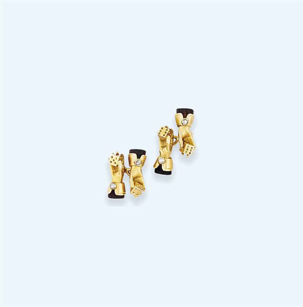 A pair of ebony and diamond set cufflinks