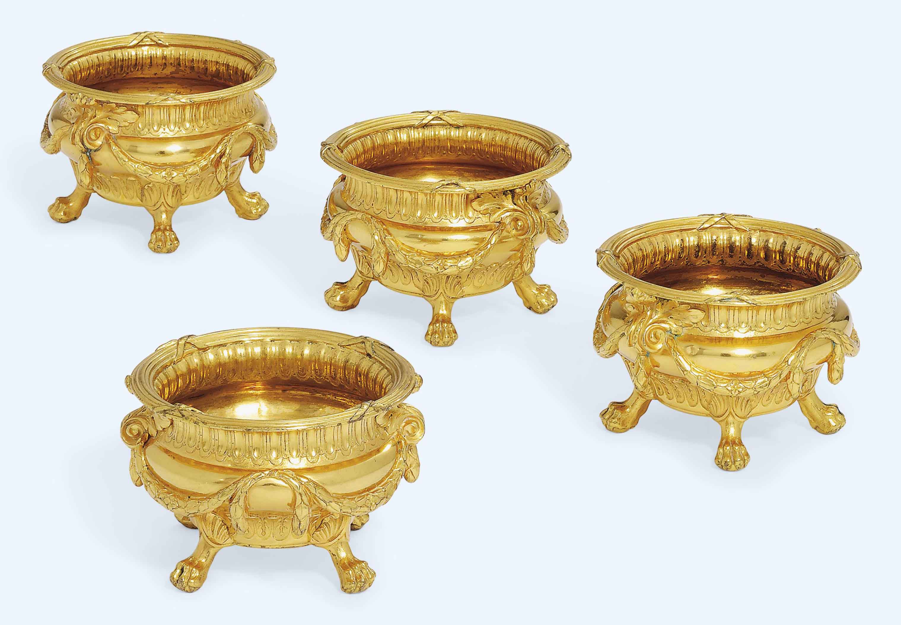 A SET OF FOUR VICTORIAN SILVER-GILT SALT-CELLARS