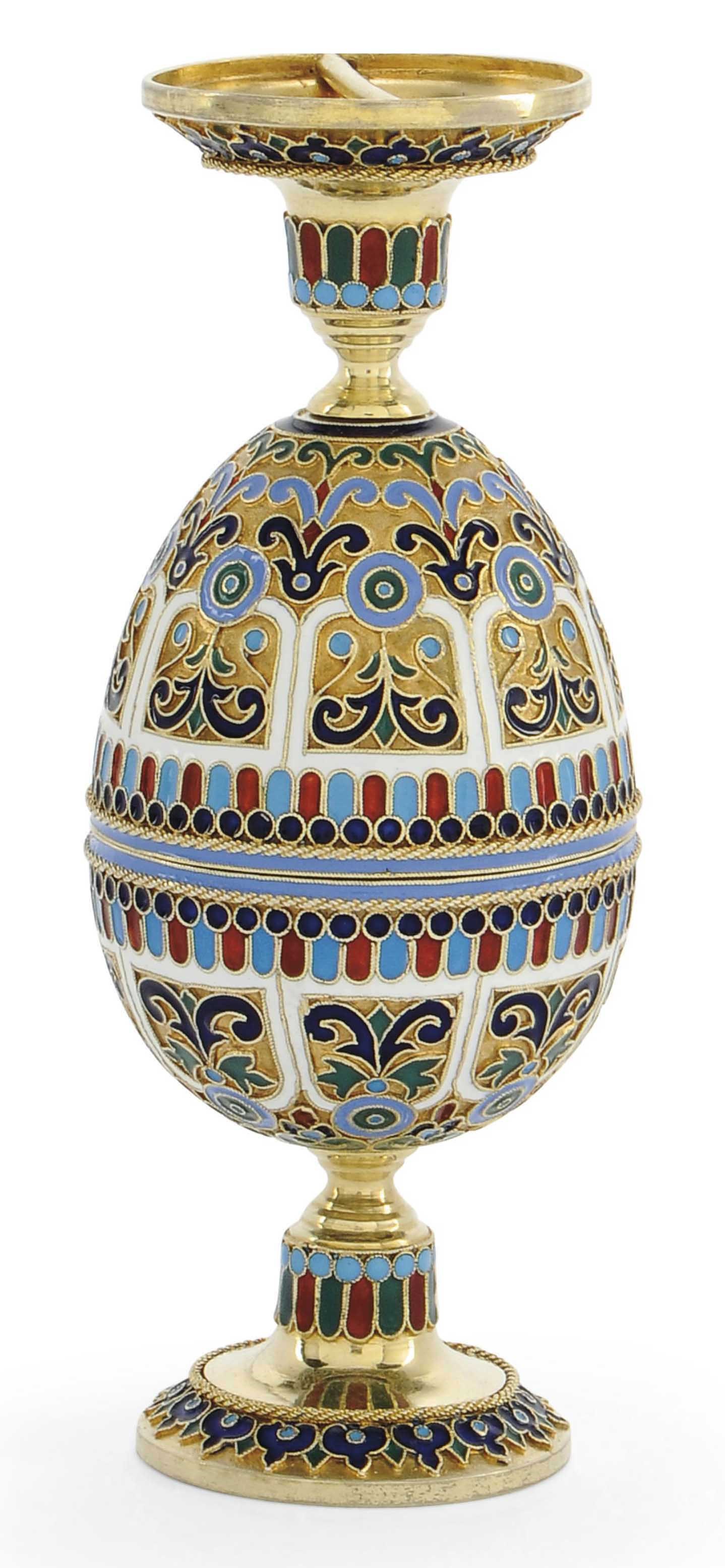 A RUSSIAN SILVER-GILT AND CLOISONNE ENAMEL EGG DISMANTLING TO FORM A PAIR OF EGG CUPS