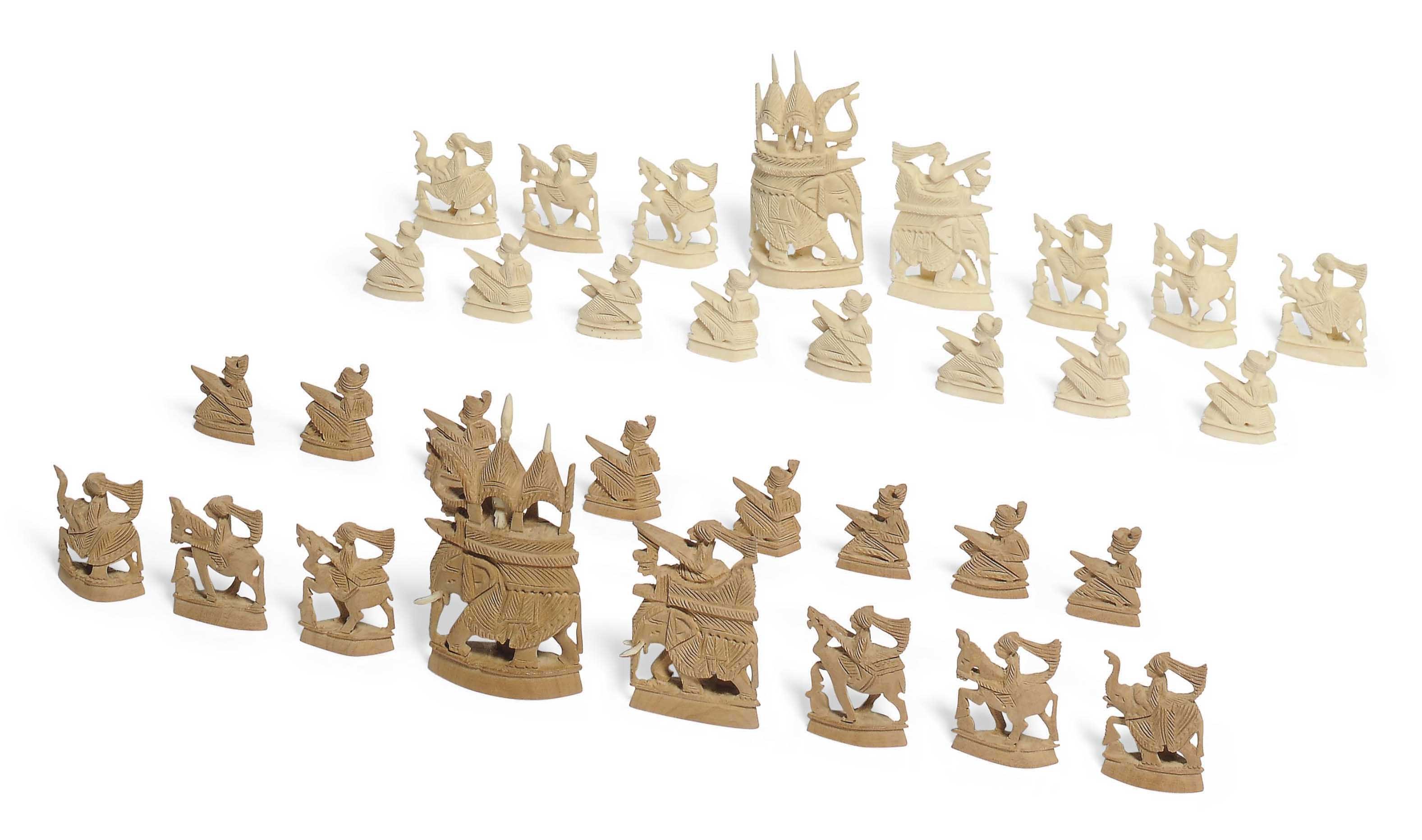 AN INDIAN IVORY AND SANDALWOOD CHESS SET