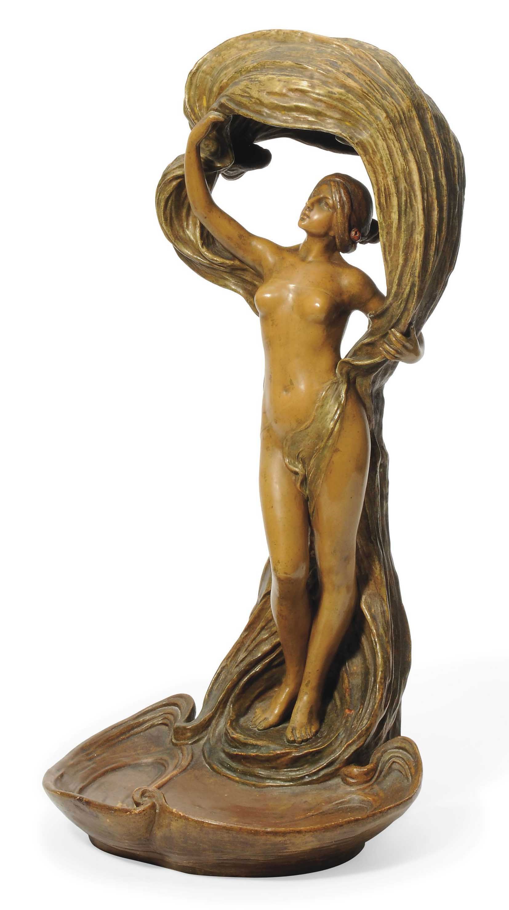 AN ART NOUVEAU EARTHENWARE FIGURAL TABLE LAMP BY ERNST WAHLISS