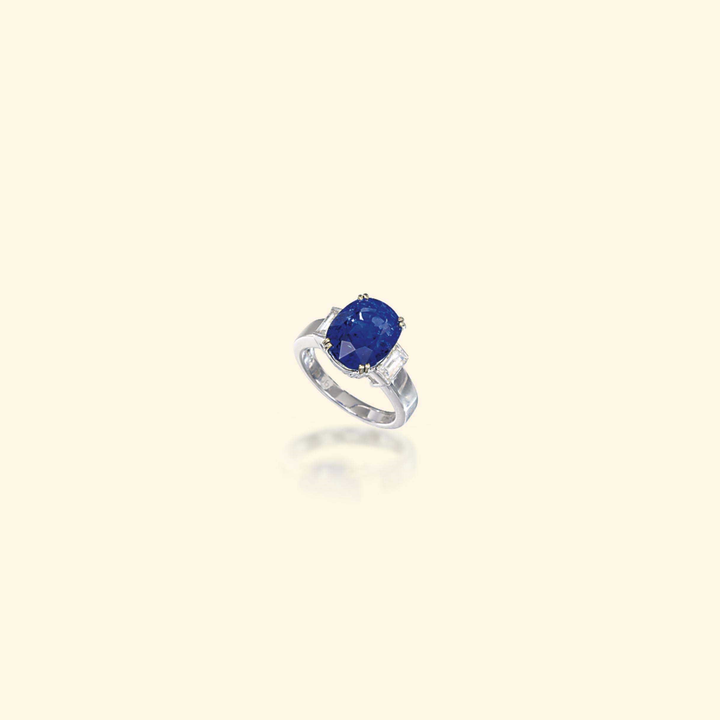 A SAPPHIRE AND DIAMOND RING