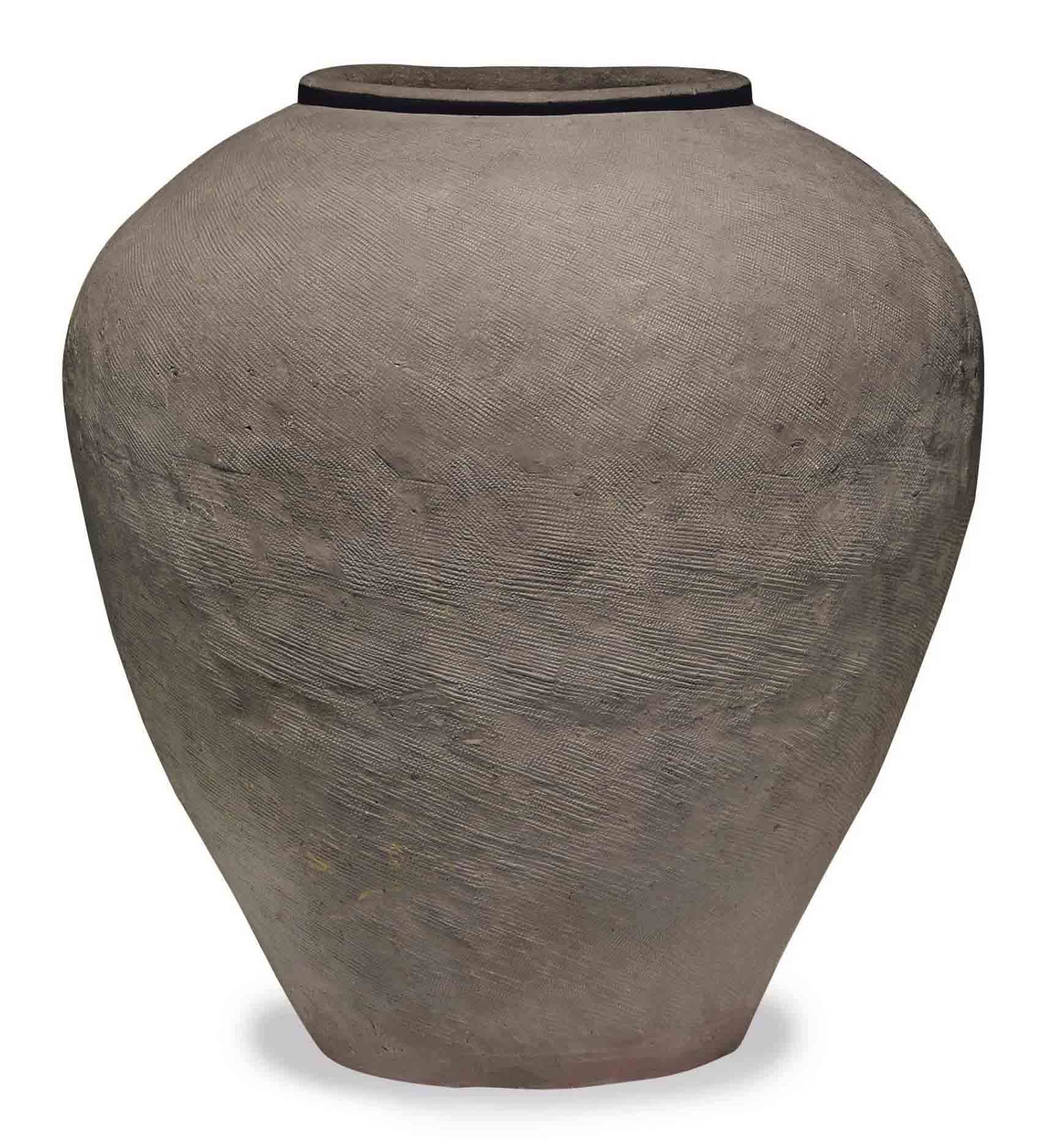A CHINESE LARGE IMPRESSED DARK GREY POTTERY OVOID JAR