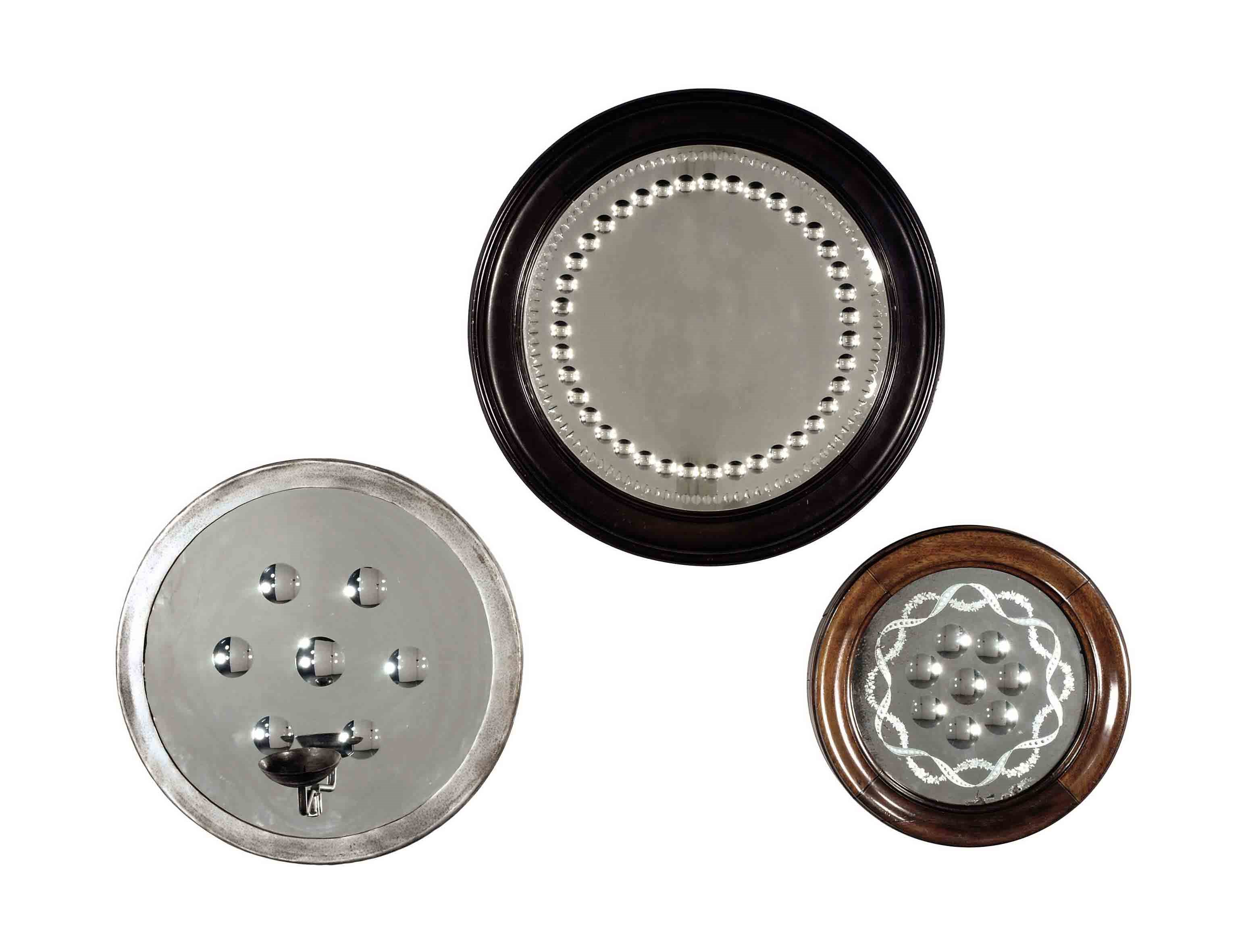 A GROUP OF FIVE CIRCULAR ENGRAVED MIRRORS,