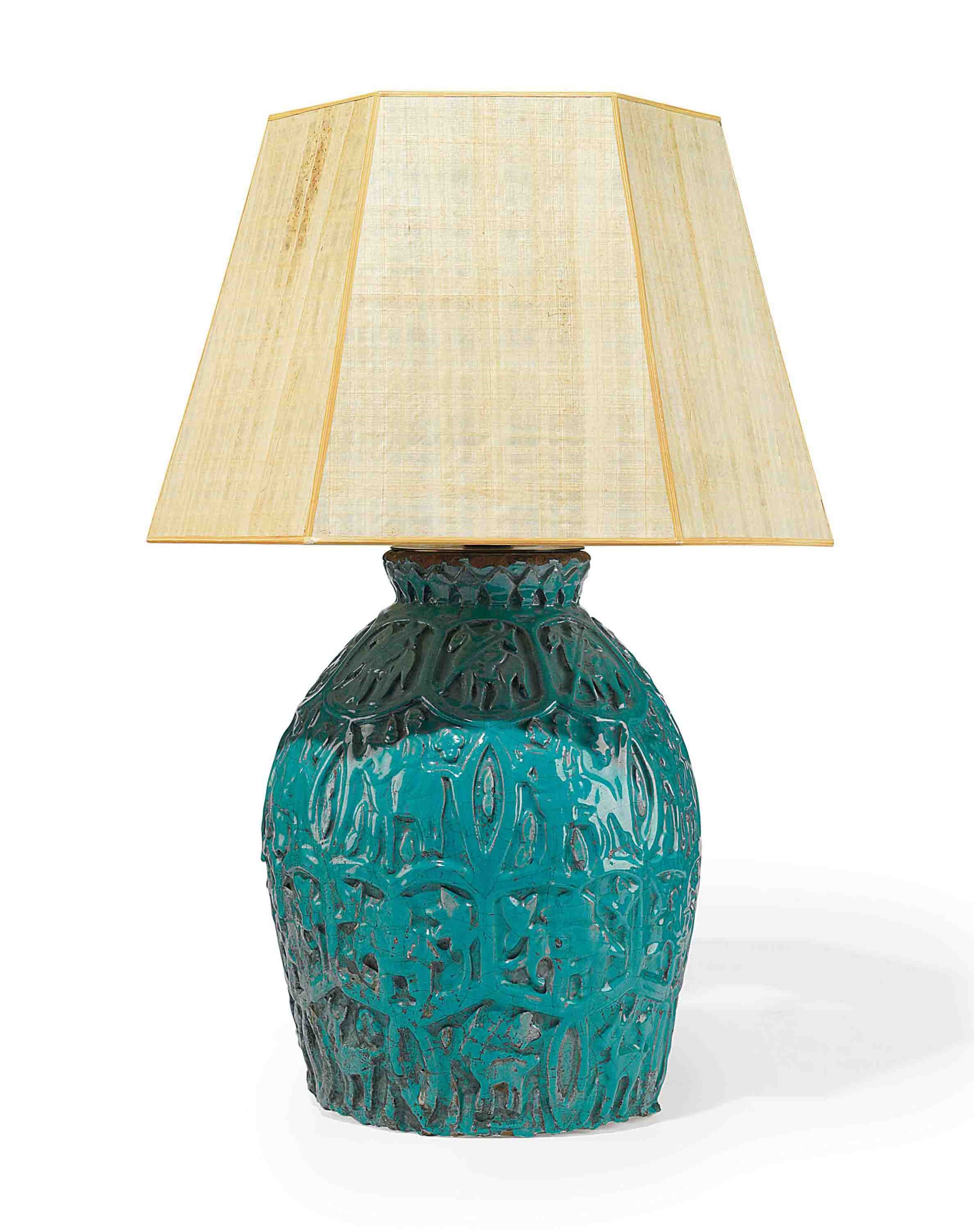 A LARGE PERSIAN TURQUOISE-GLAZED MOULDED POTTERY LAMP