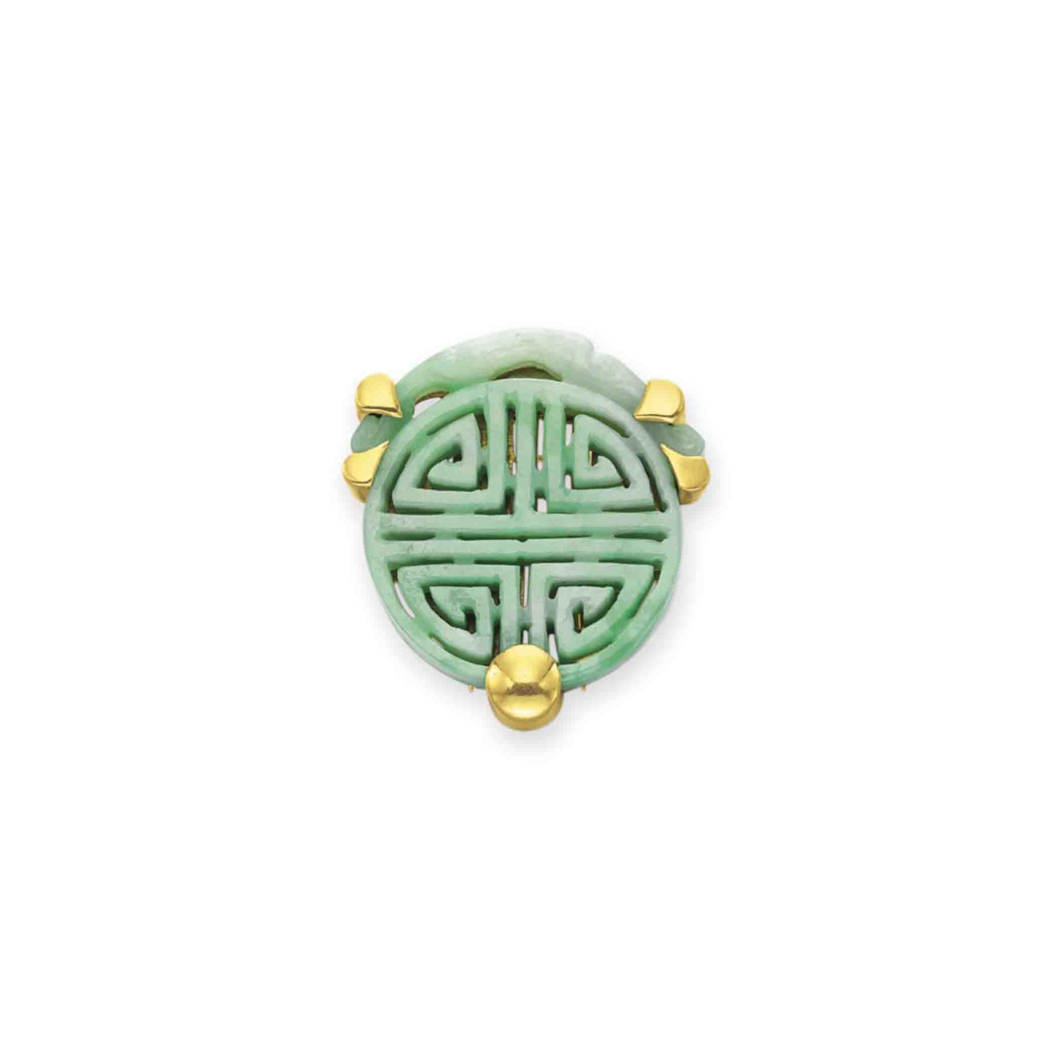 A JADE CLIP BROOCH