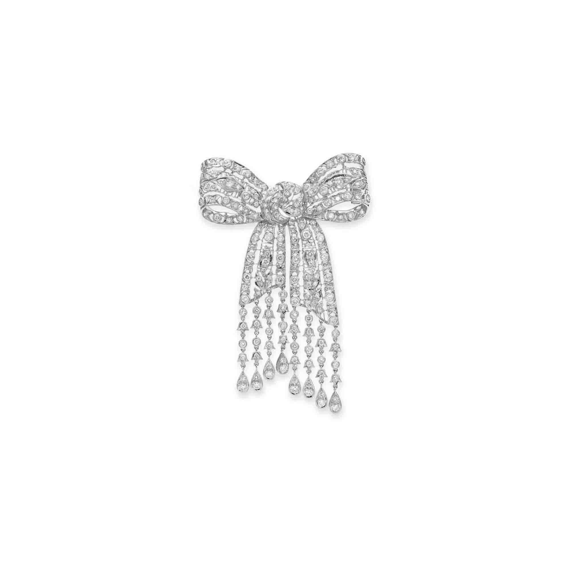 A DIAMOND BOW BROOCH