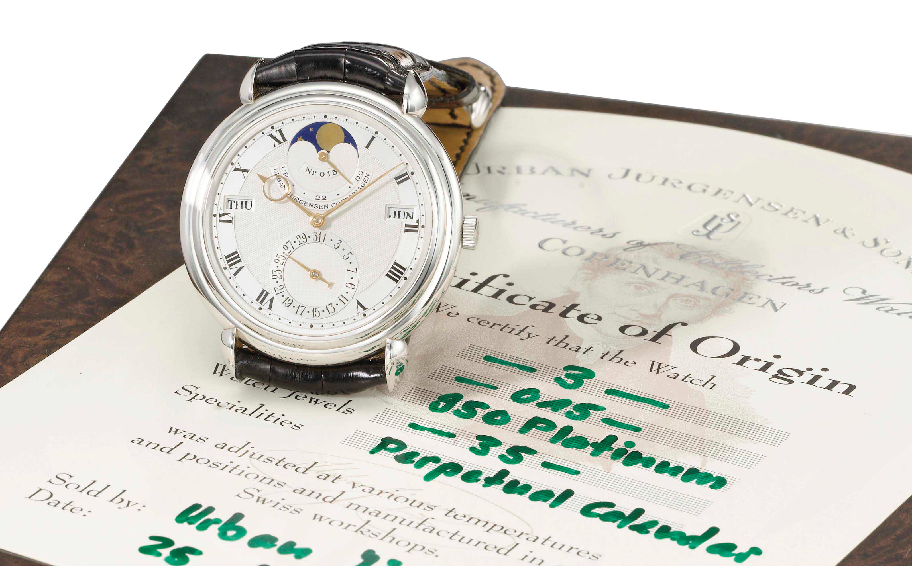 Urban Jürgensen. A fine platinum automatic perpetual calendar wristwatch with moon phases, power reserve, original certificate and box