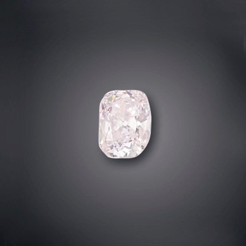 AN UNMOUNTED COLOURED DIAMOND