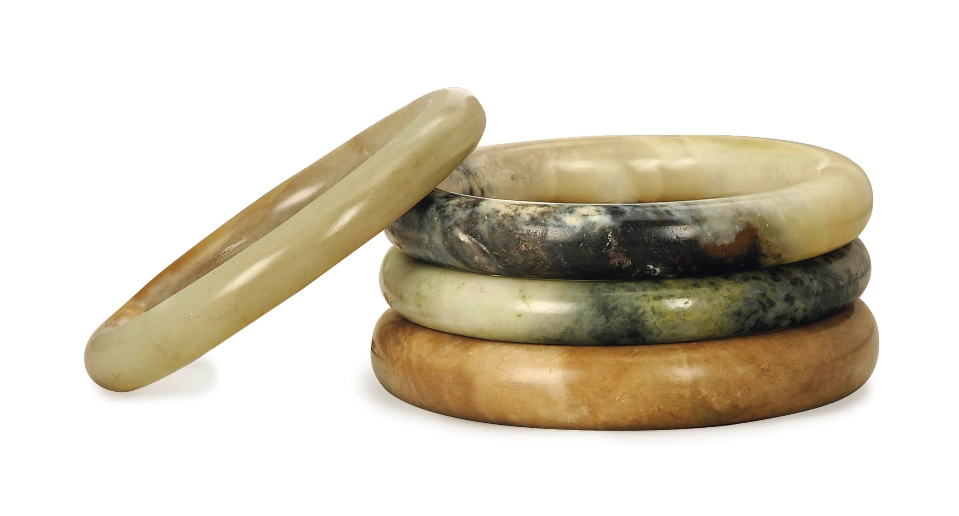 FOUR CHINESE JADE BANGLES
