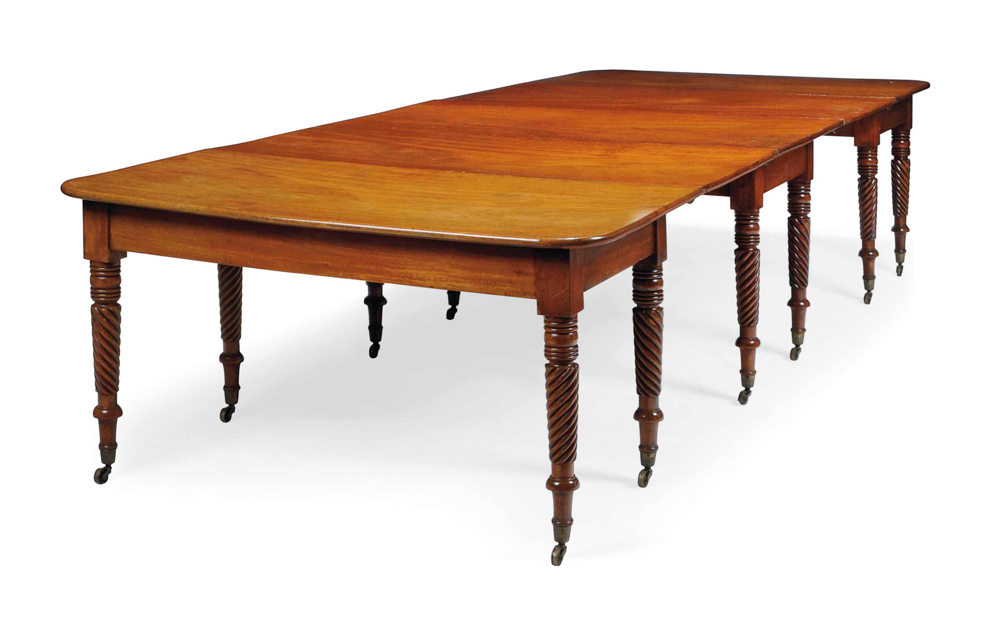 A GEORGE IV MAHOGANY EXTENDING DINING TABLE