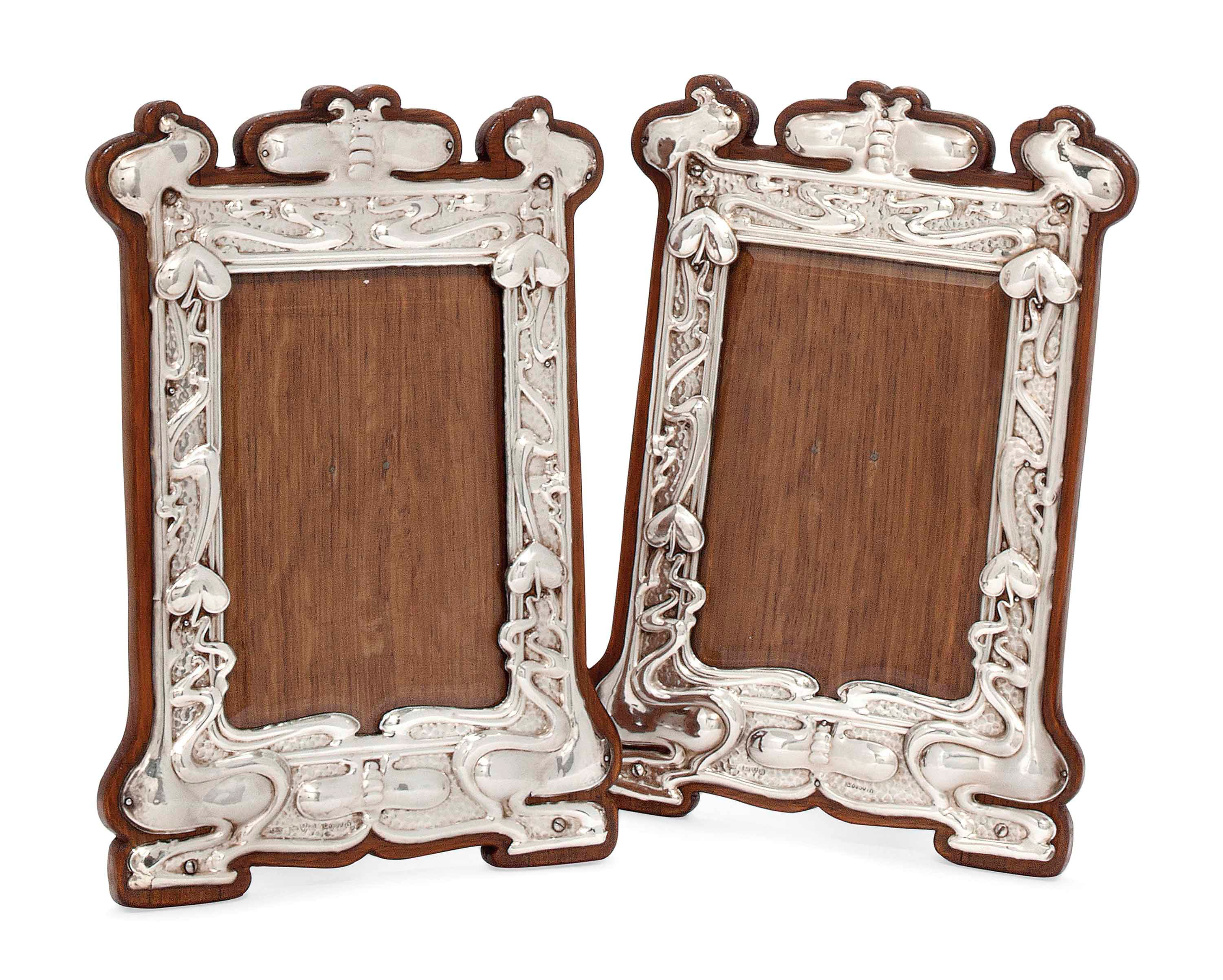 A MATCHED PAIR OF EDWARDIAN ART NOUVEAU SILVER PHOTOGRAPH FRAMES