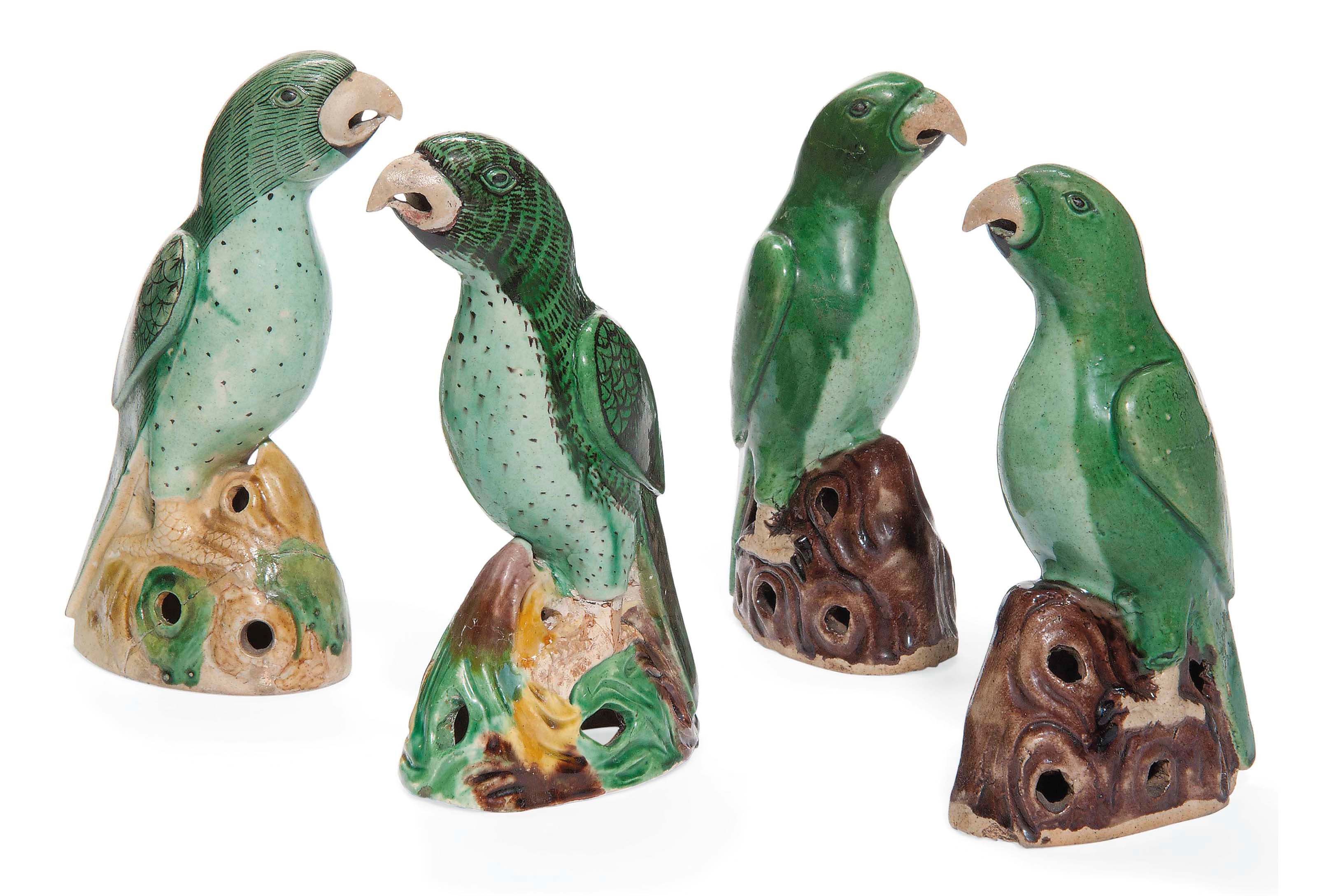 FOUR CHINESE GREEN-GLAZED MODELS OF PARROTS