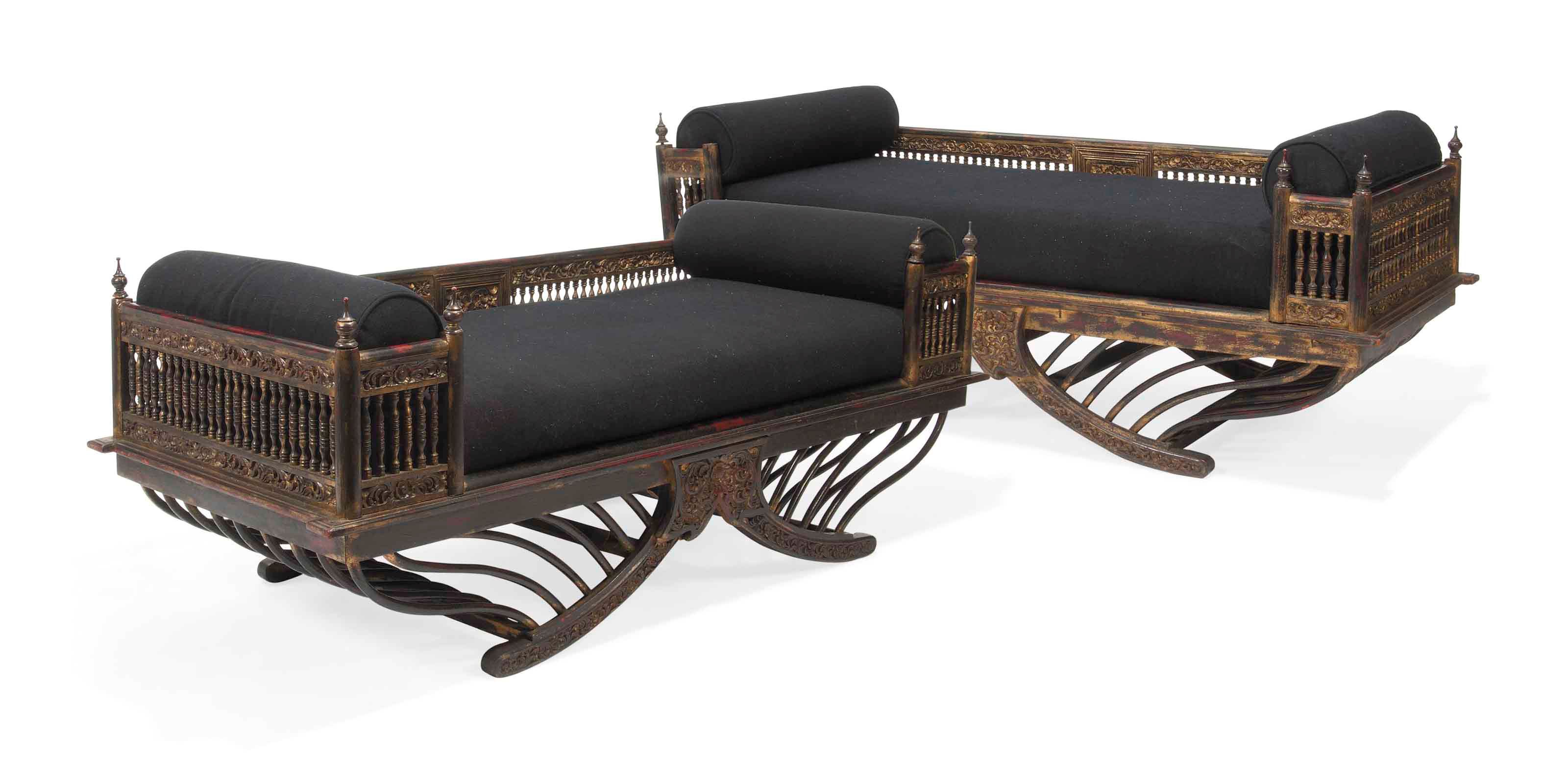 A PAIR OF SOUTH-EAST ASIAN EBONISED AND PARCEL-GILT SEATS