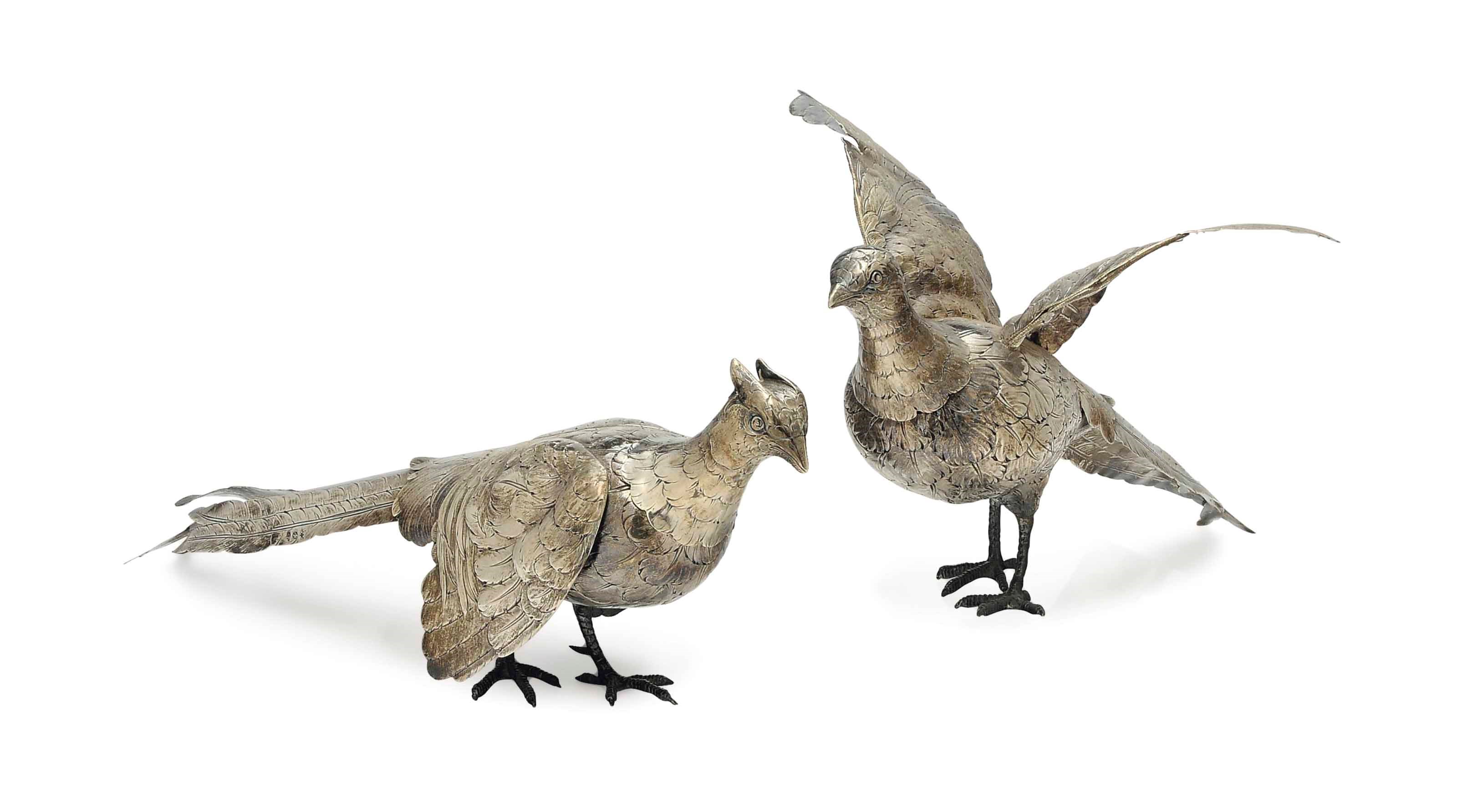 A MATING PAIR OF CONTINENTAL SILVER MODELS OF PHEASANTS,