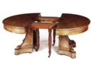 AN EMPIRE MAHOGANY EXTENDING DINING TABLE