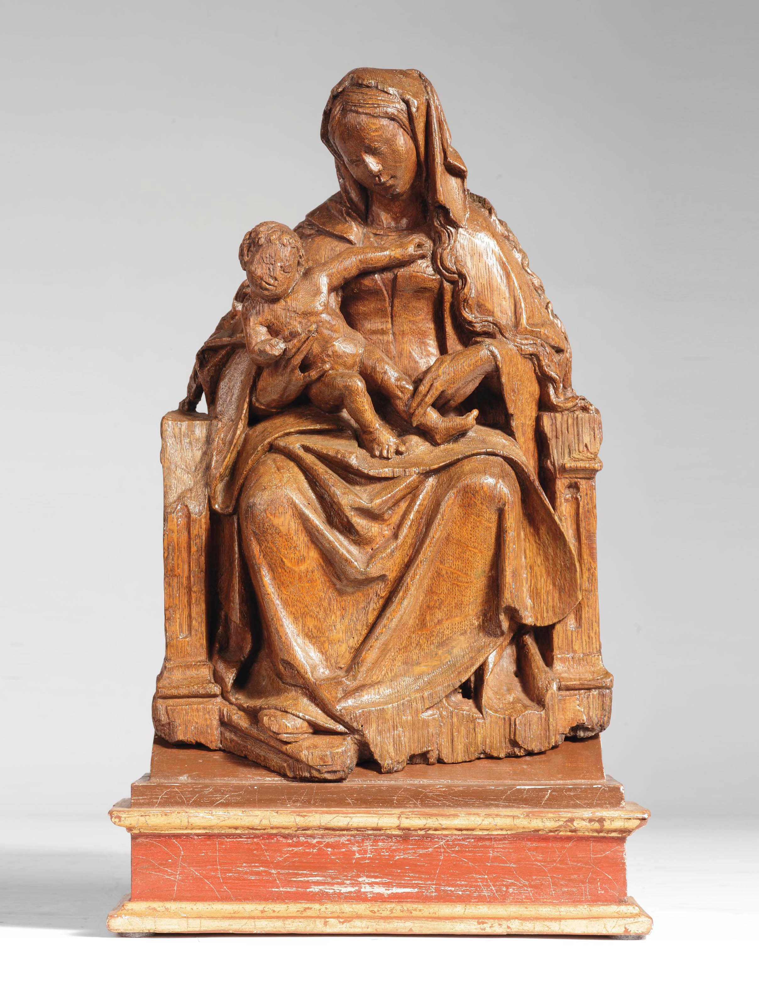 A CARVED OAK GROUP OF THE VIRGIN ENTHRONED
