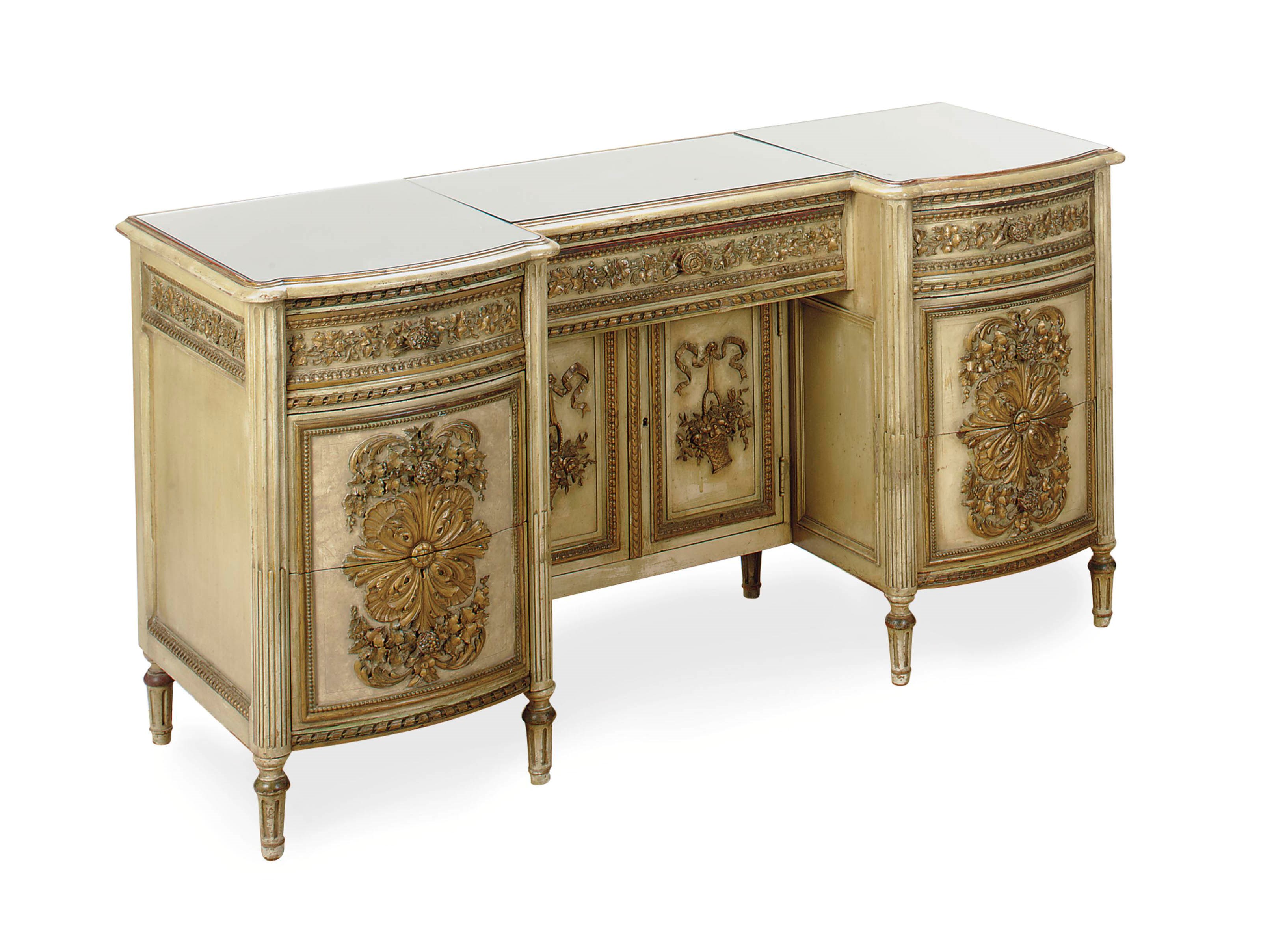 A PARCEL-SILVERED AND WHITE-PAINTED CARVED AND MIRRORED DESSSING TABLE,