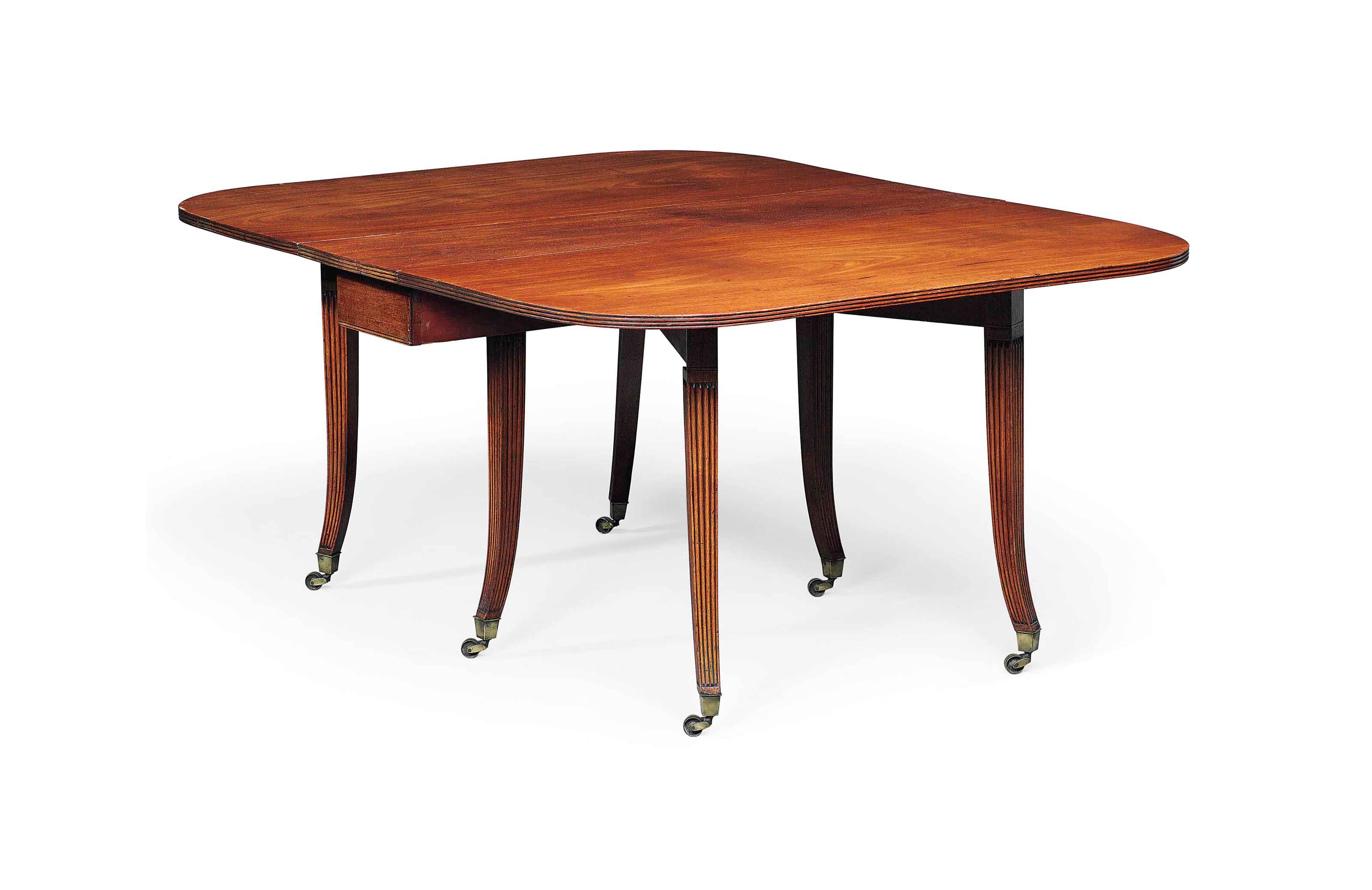 A REGENCY MAHOGANY DROP-LEAF DINING TABLE