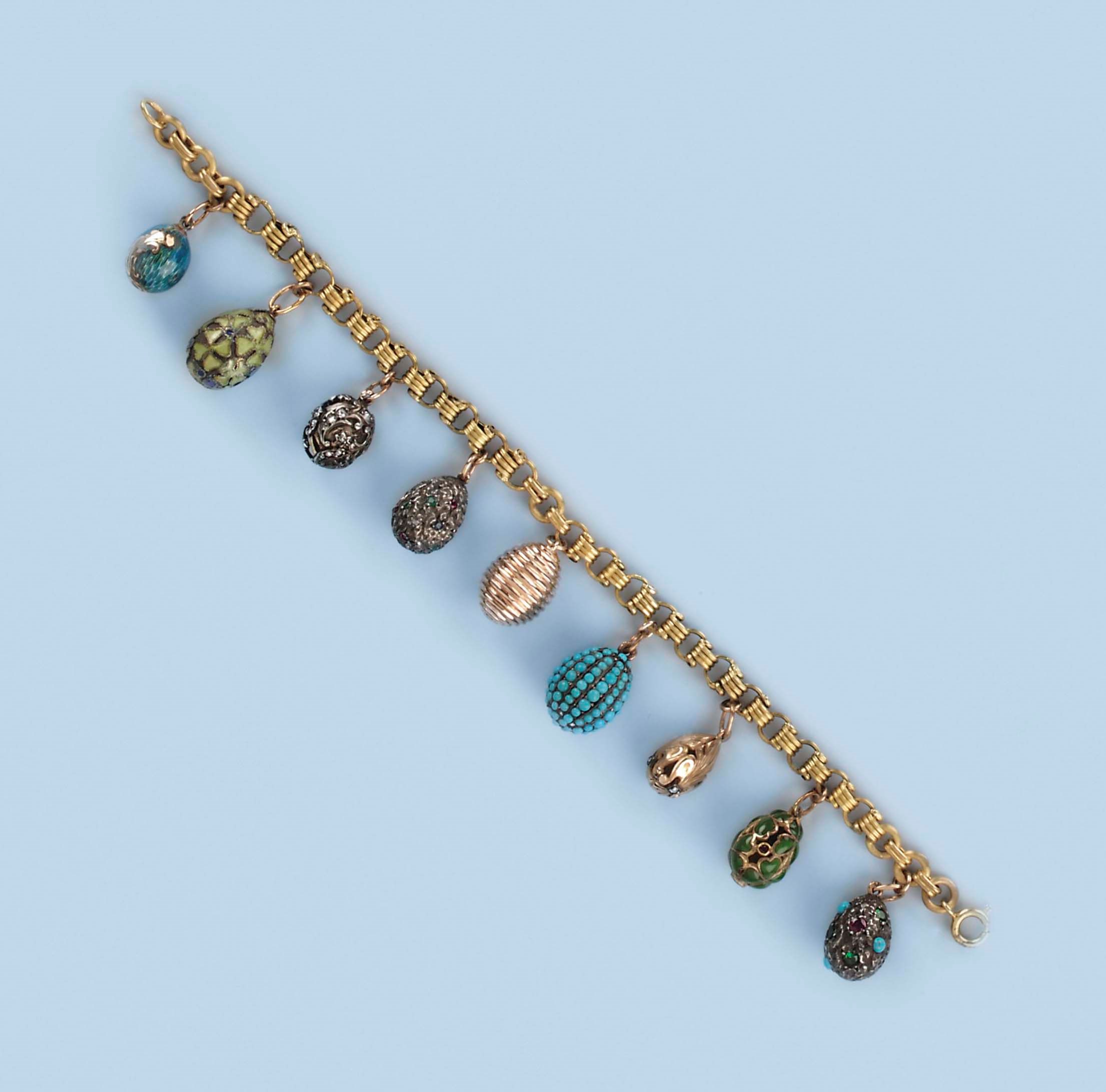 A RUSSIAN ENAMEL EGG CHARM BRACELET