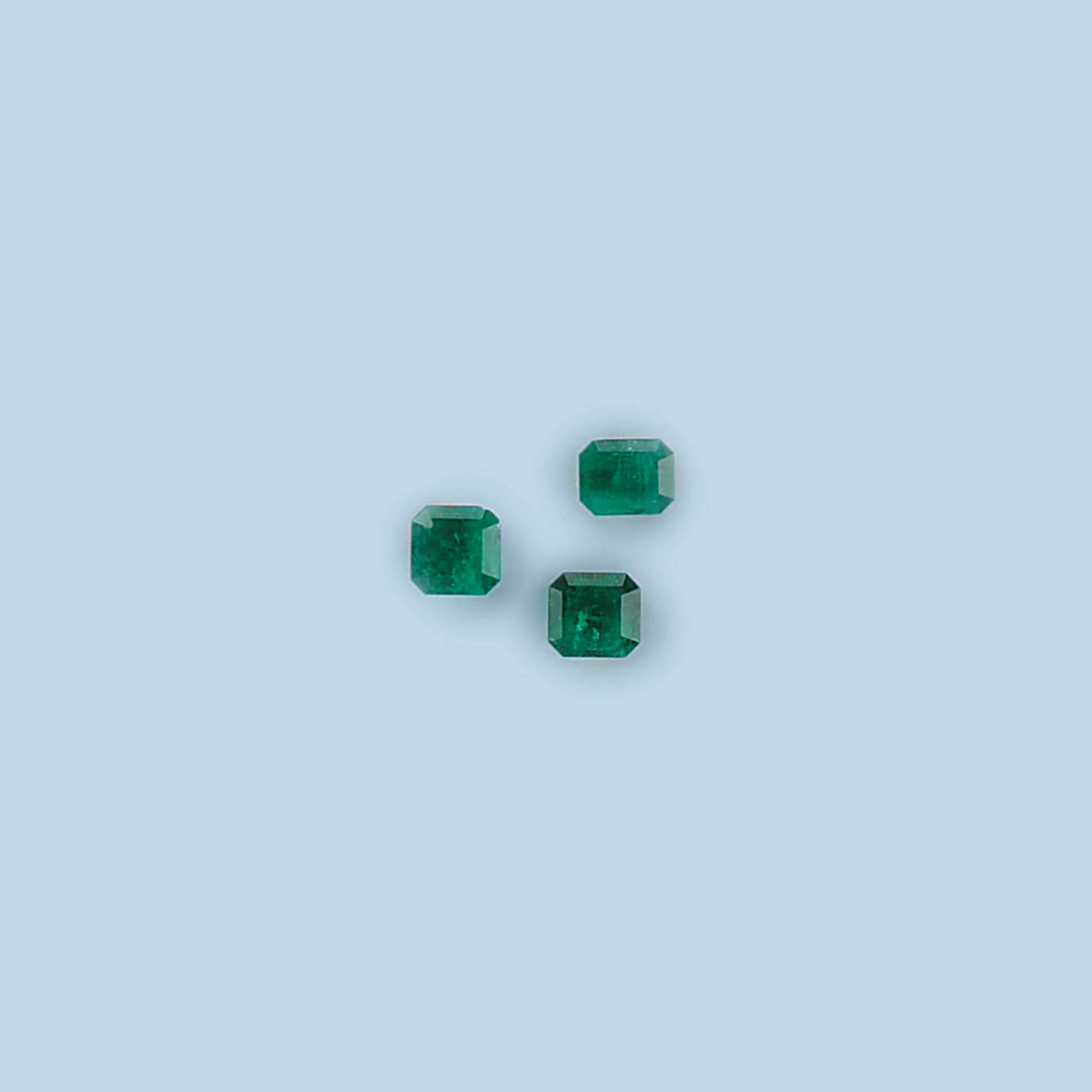FIVE UNMOUNTED EMERALDS