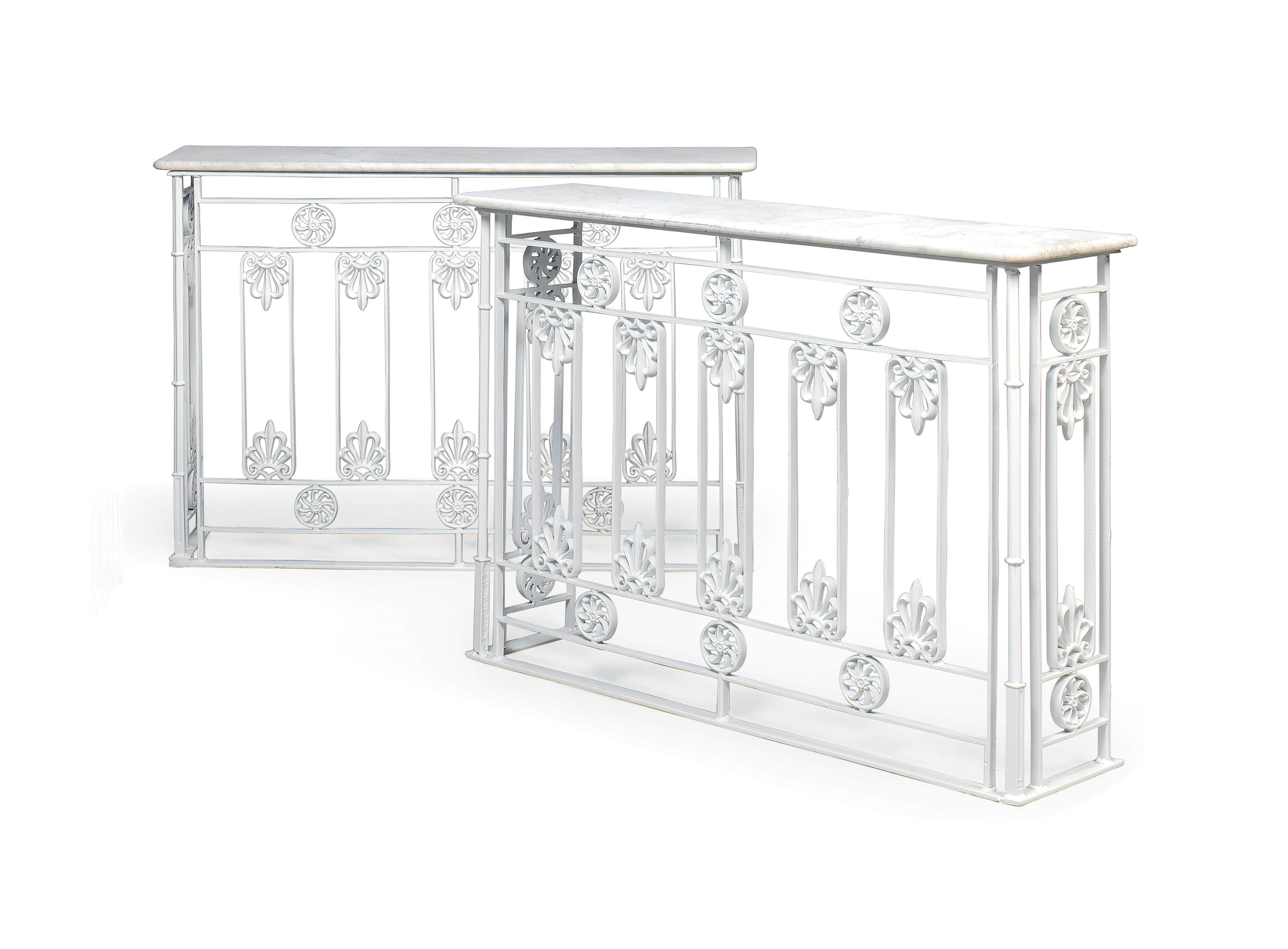 A PAIR OF WHITE-PAINTED CAST IRON RADIATOR COVERS