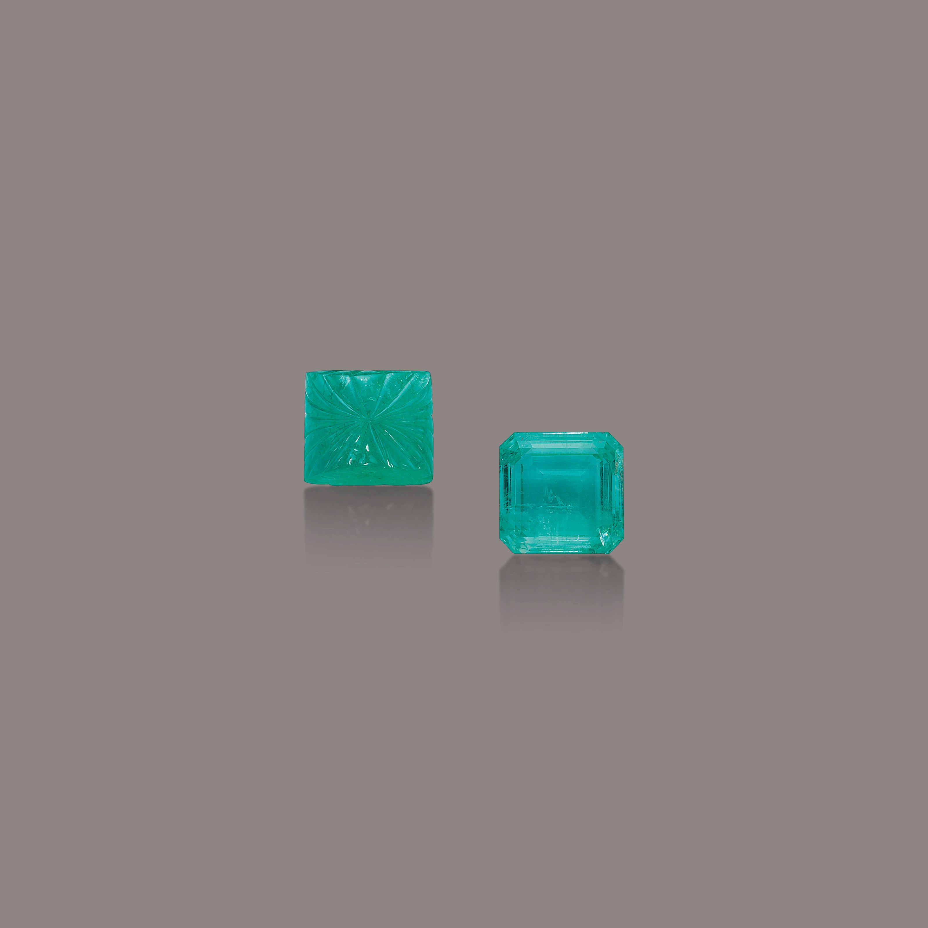 TWO UNMOUNTED EMERALDS
