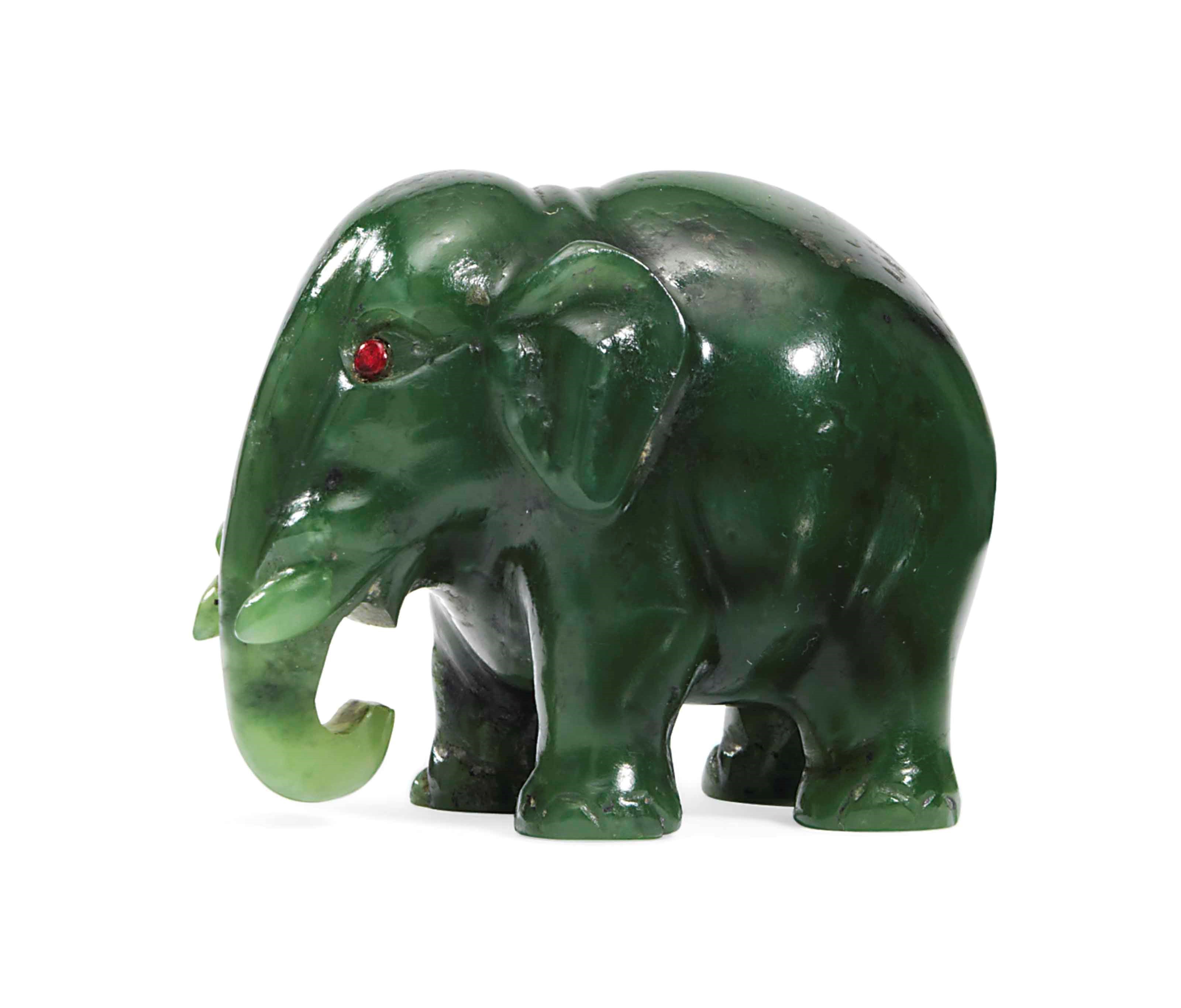 A CARVED NEPHRITE MODEL OF AN ELEPHANT