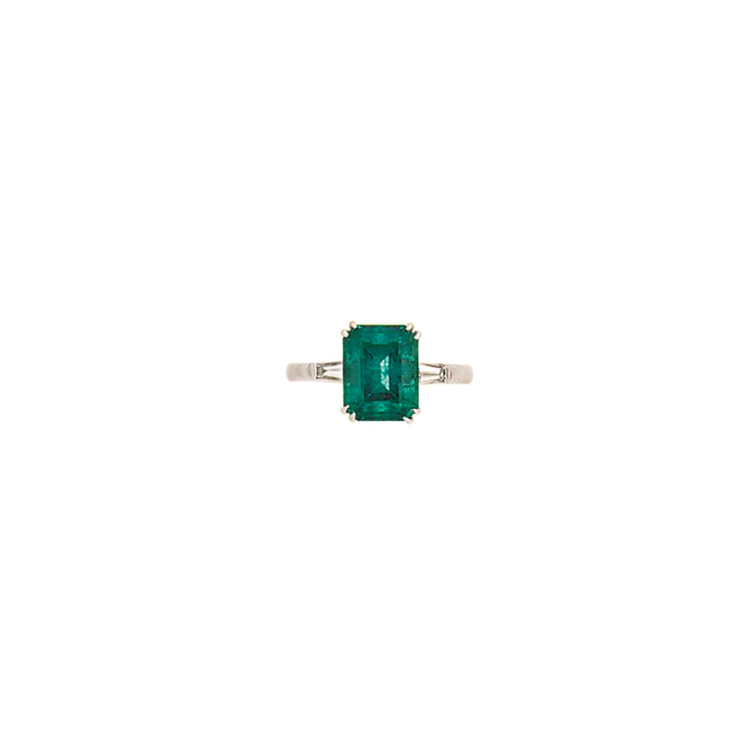 An emerald and diamond ring