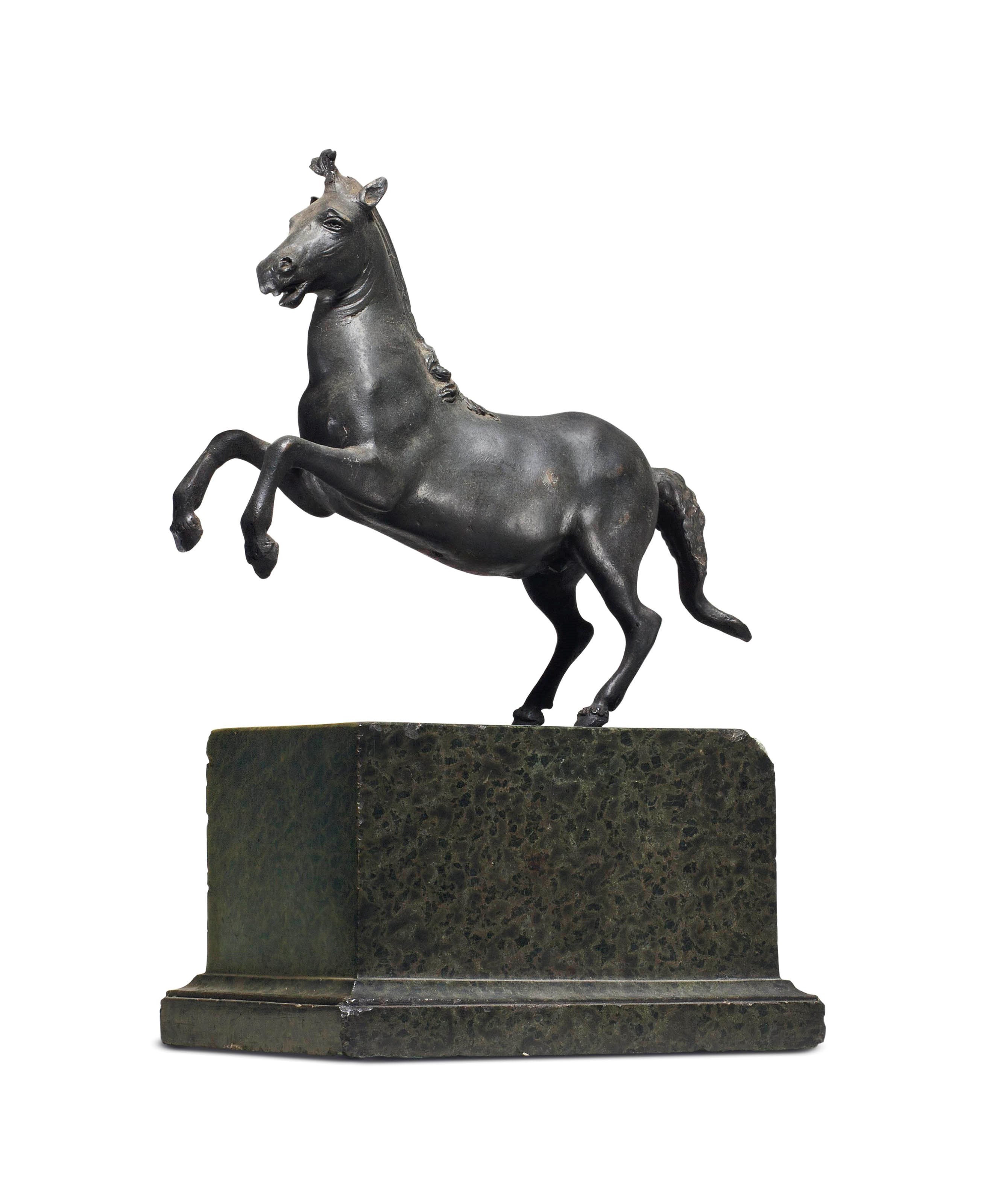 A BRONZE MODEL OF A REARING HORSE,