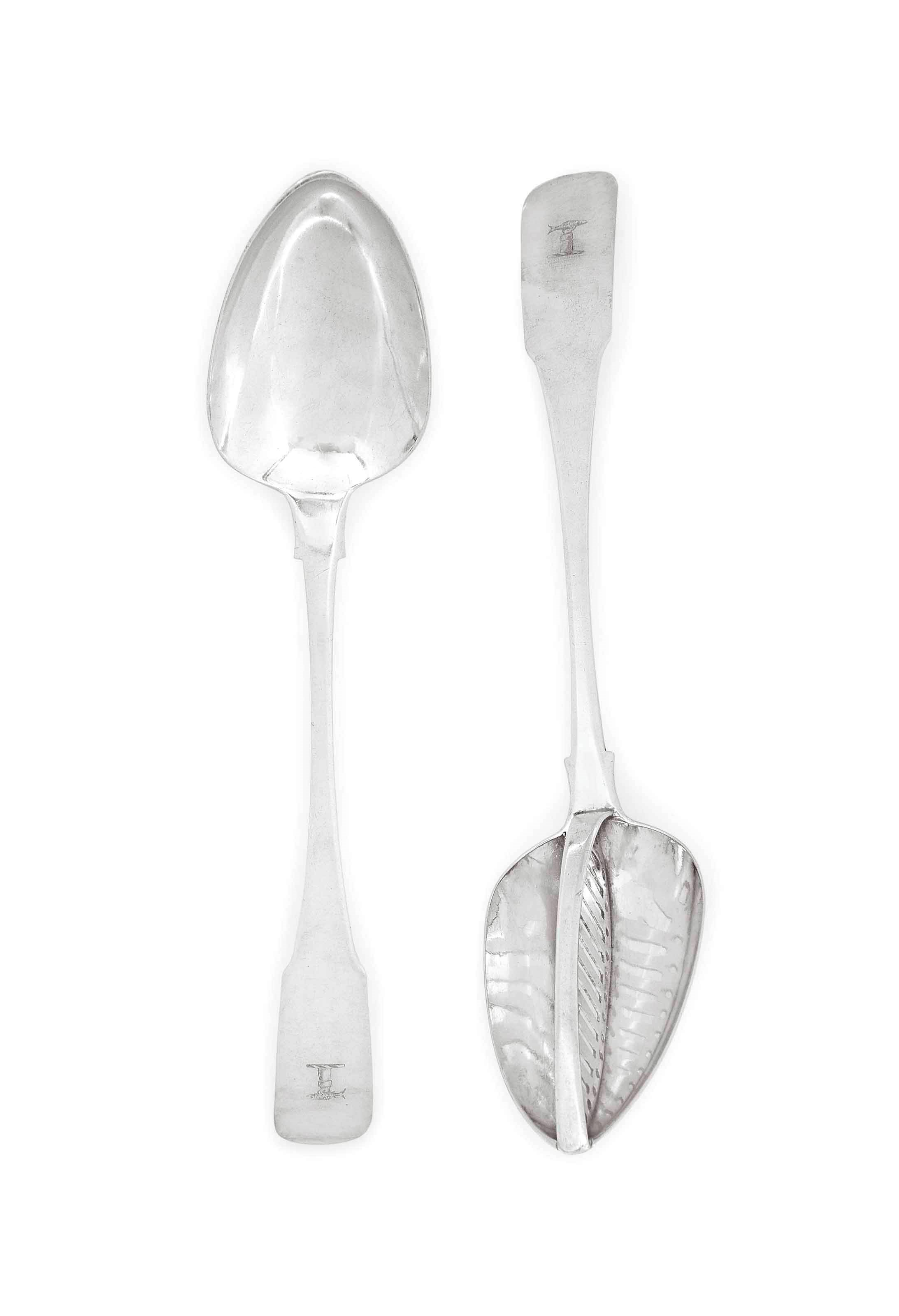 A GEORGE III IRISH SILVER FIDDLE PATTERN STRAINING SPOON AND A BASTING SPOON EN SUITE