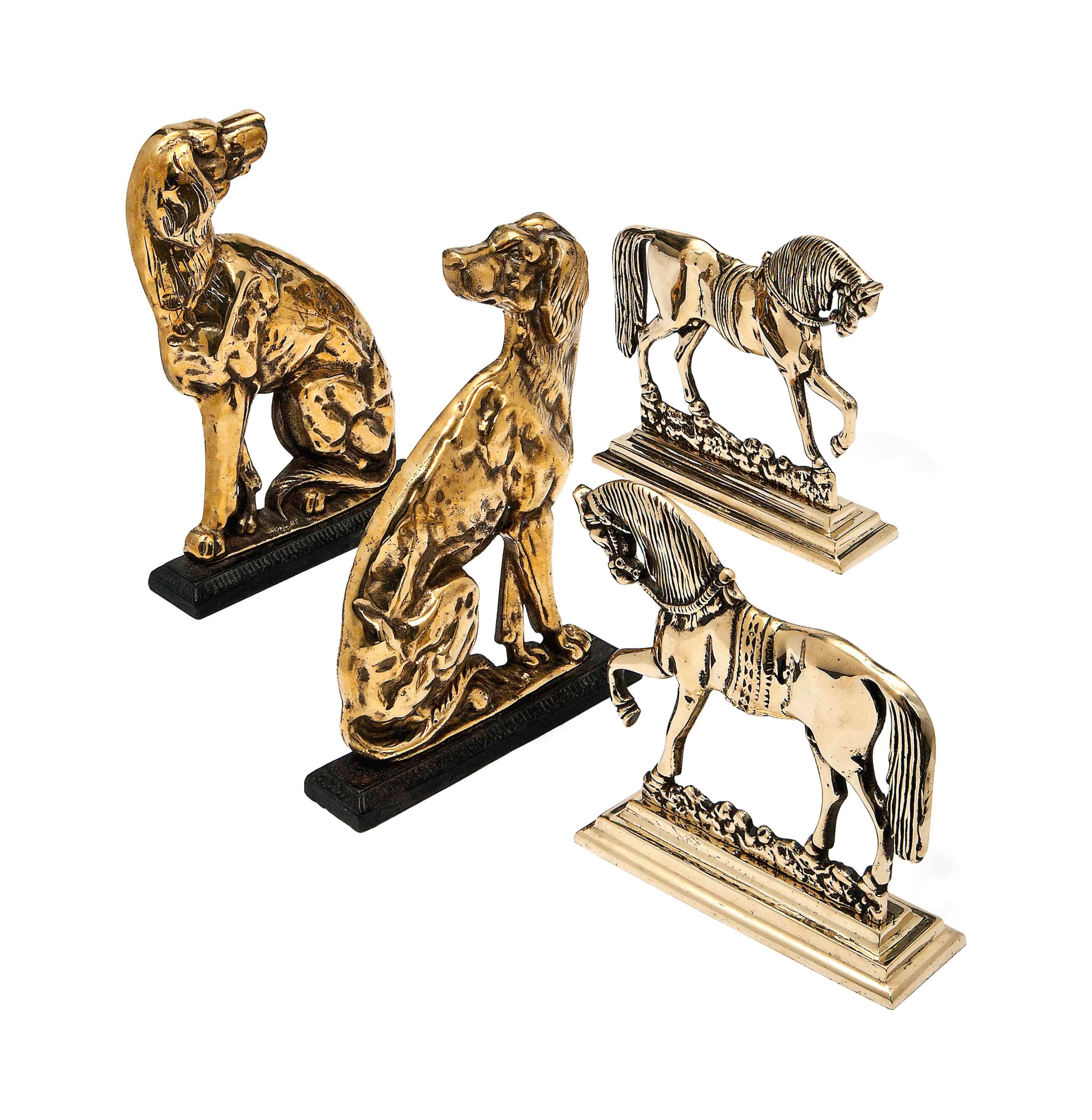 TWO PAIRS OF ENGLISH BRASS DOORSTOPS