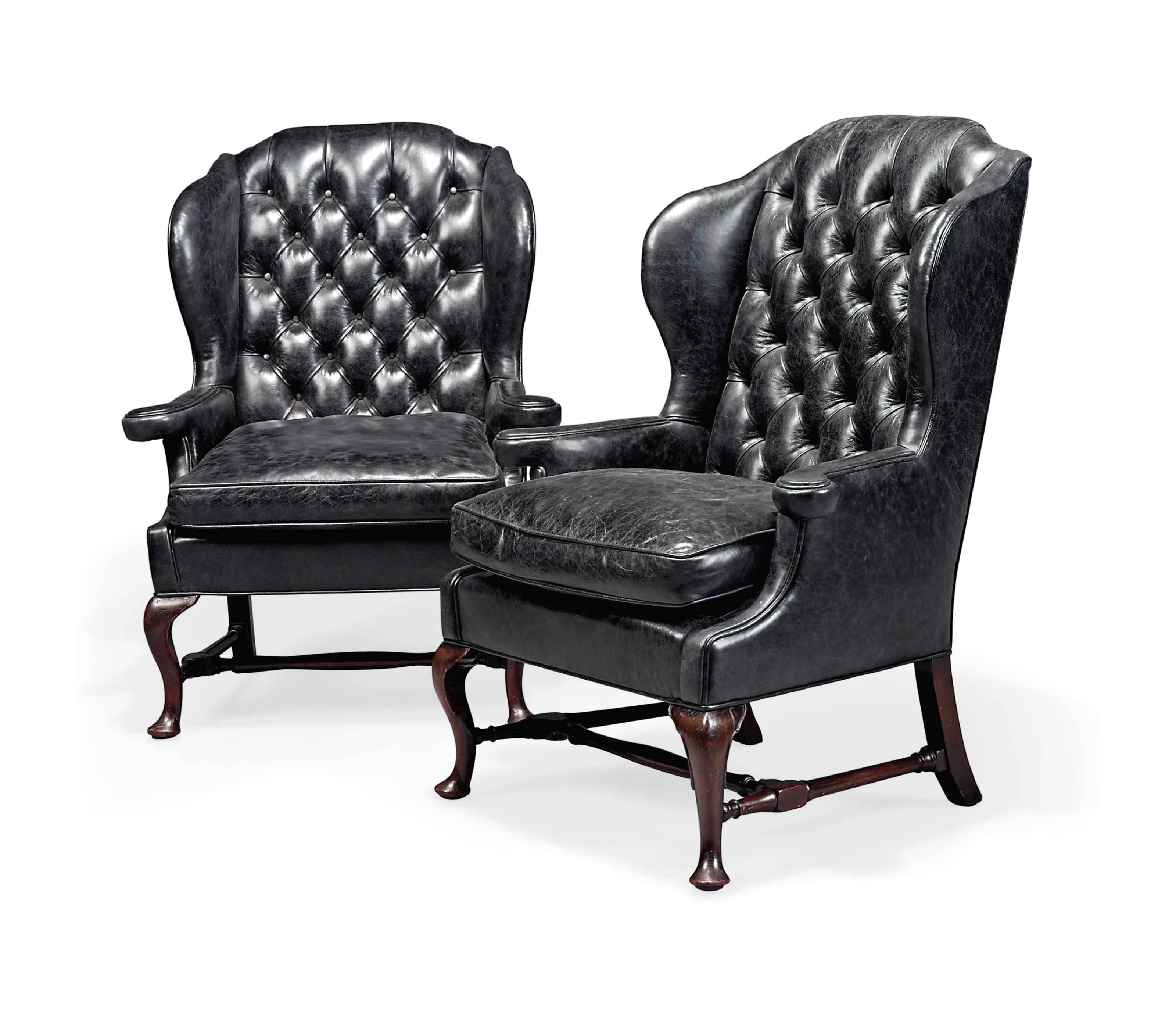 A PAIR OF MAHOGANY WING ARMCHAIRS