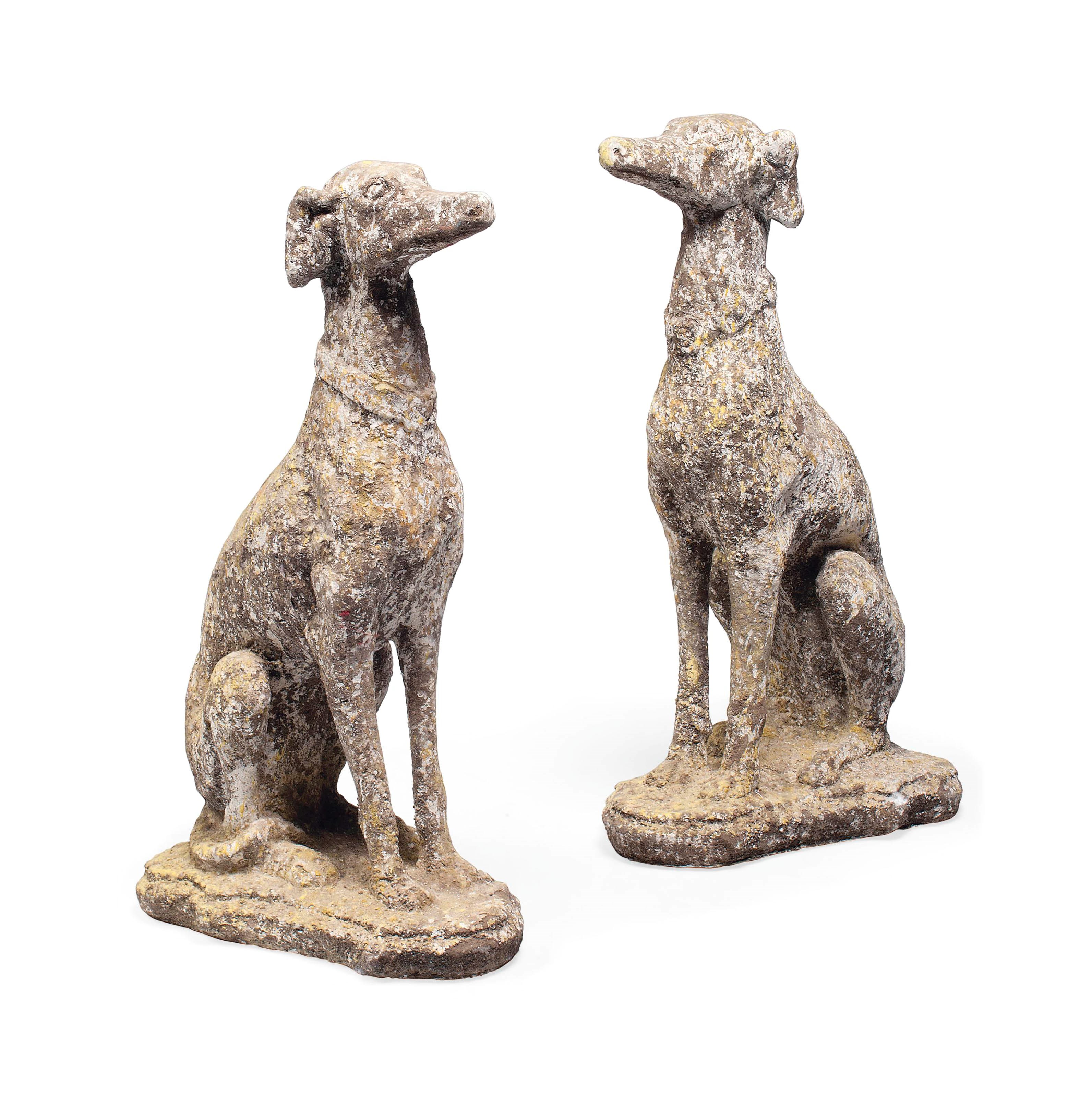 A PAIR OF COMPOSITION STONE MODELS OF GREYHOUNDS